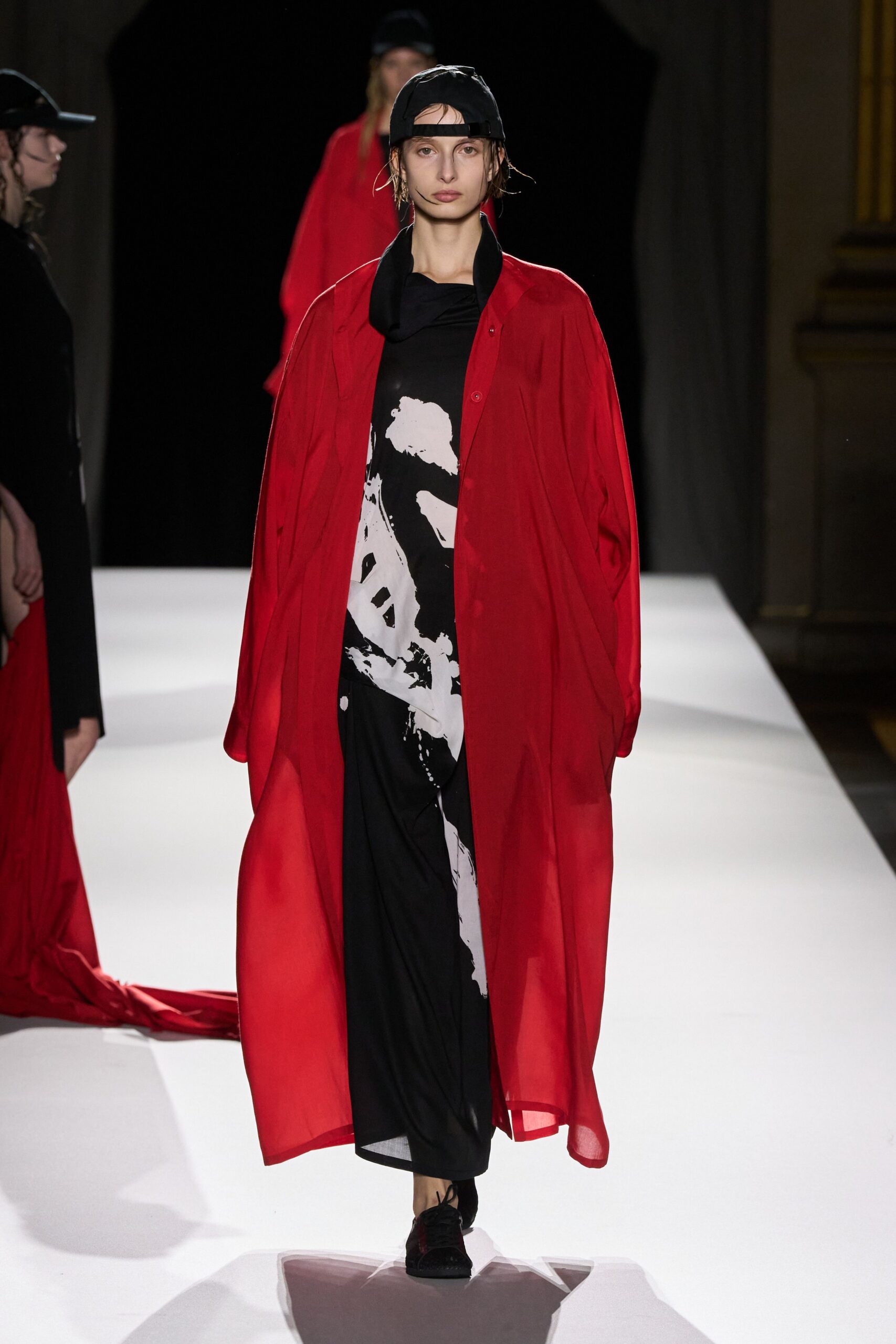 red silk long-sleeve collared oversized buttoned flowing coat