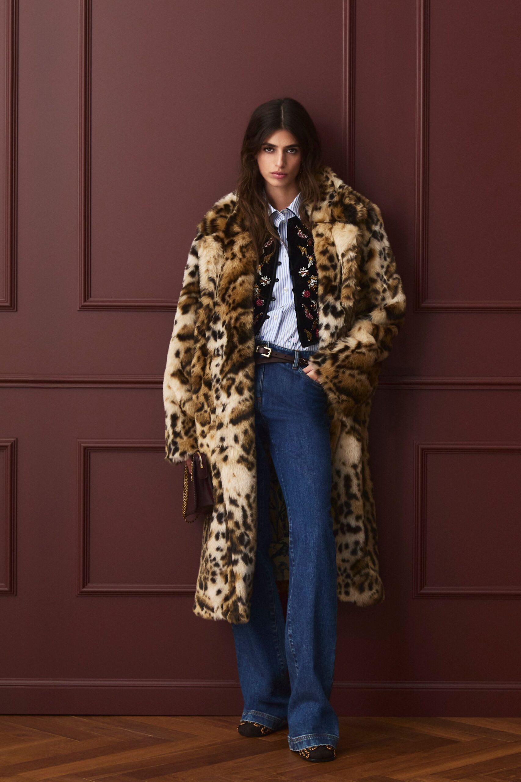 brown faux-fur coat with denim pants