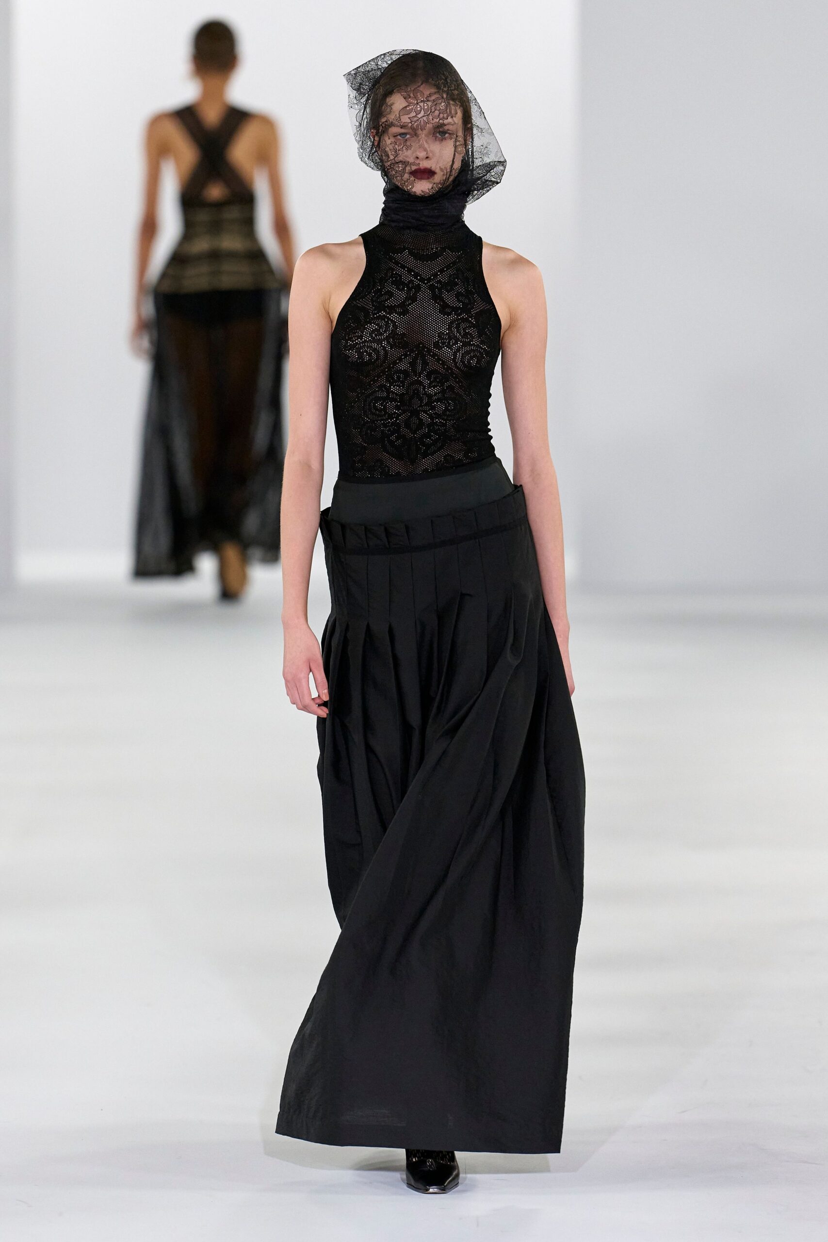 black lace sleeveless high-neck fitted embroidered top