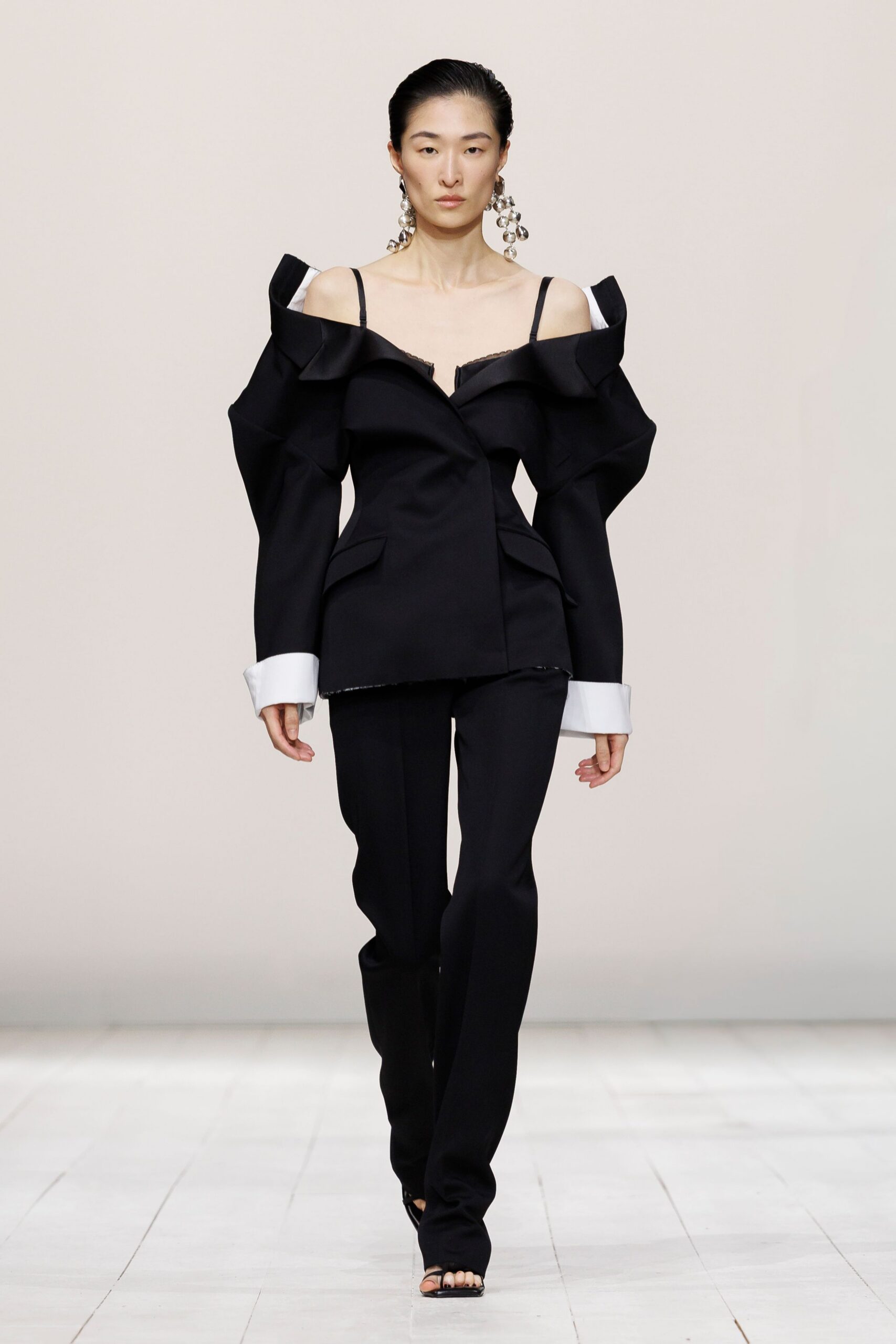 black cotton long-sleeve off-shoulder structured ruffled blazer