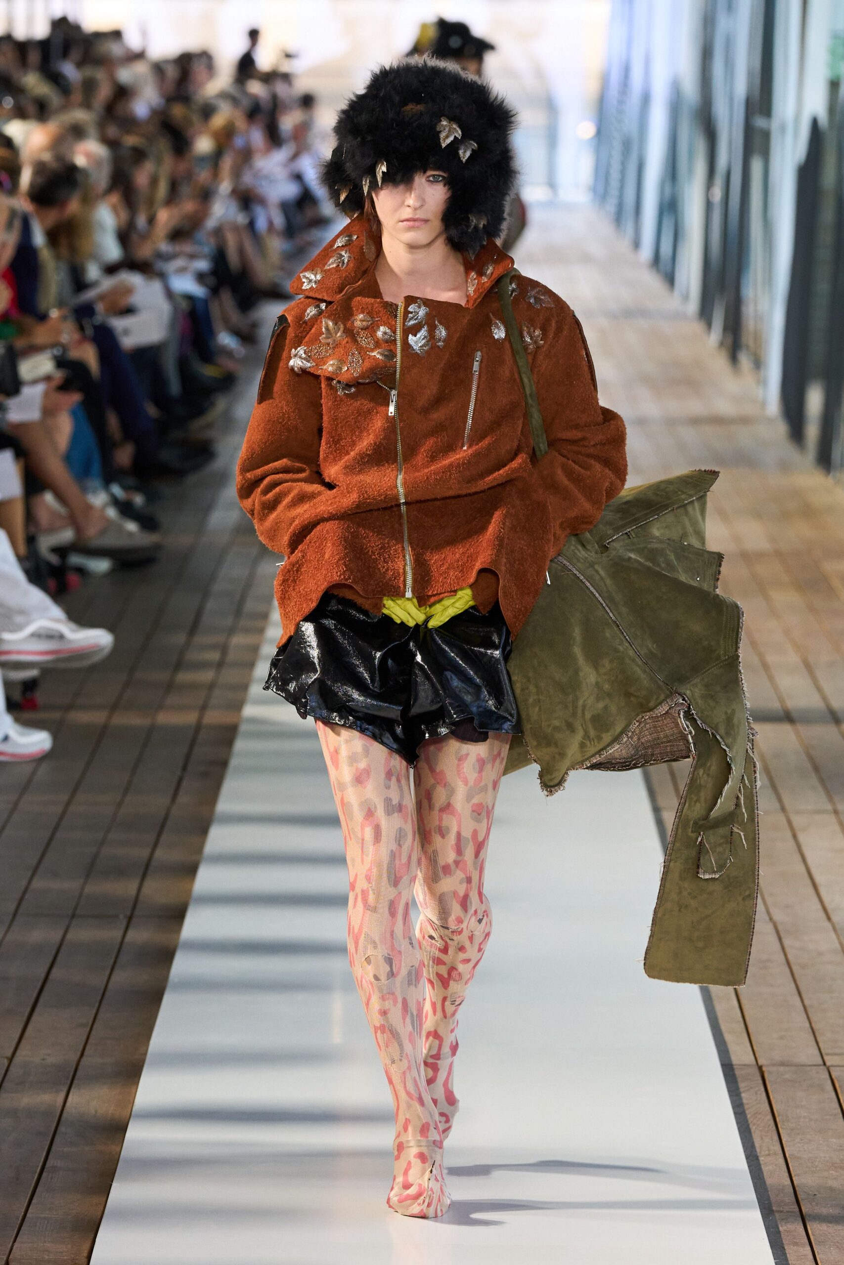 brown faux-fur jacket with black shorts