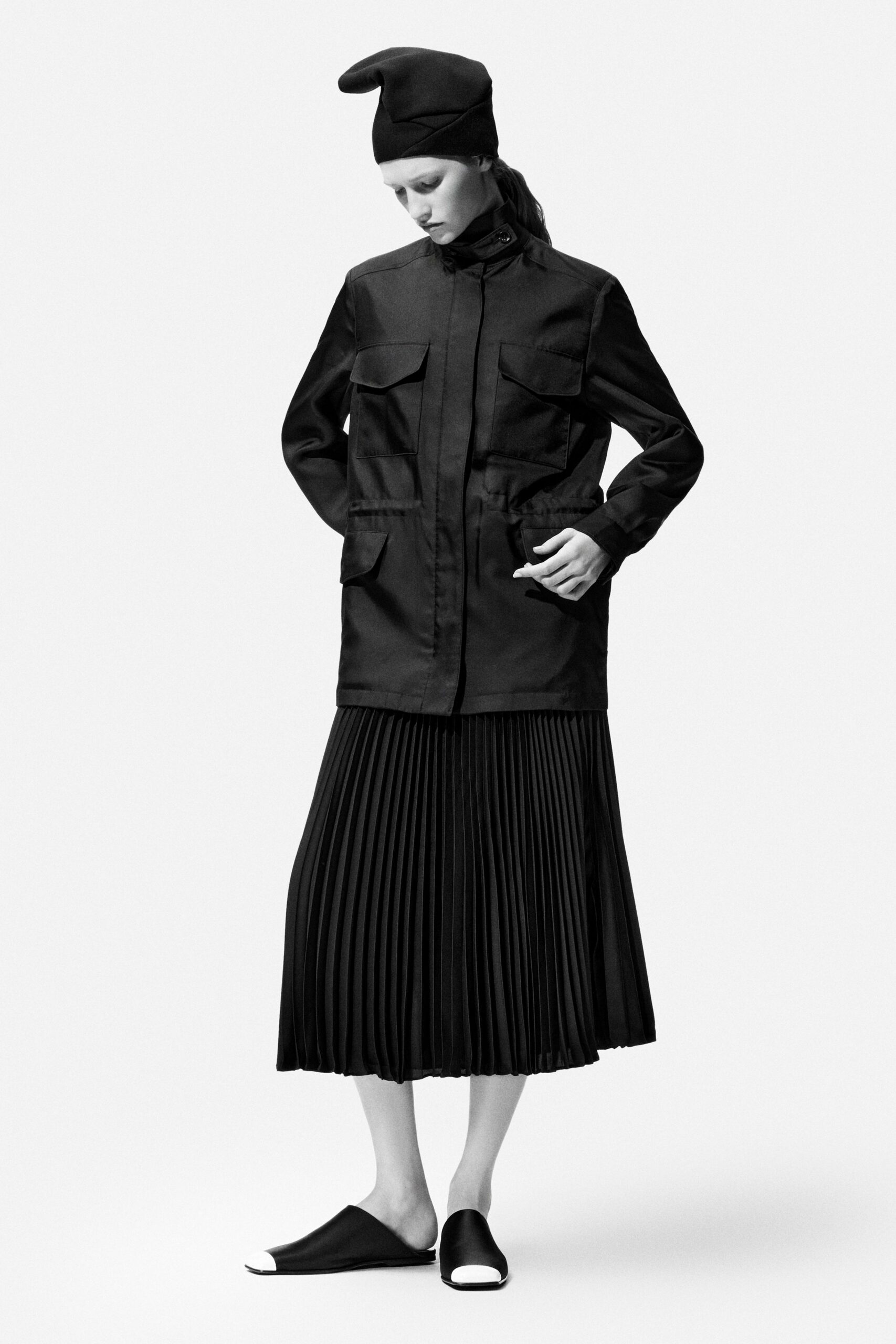 black jacket and pleated skirt