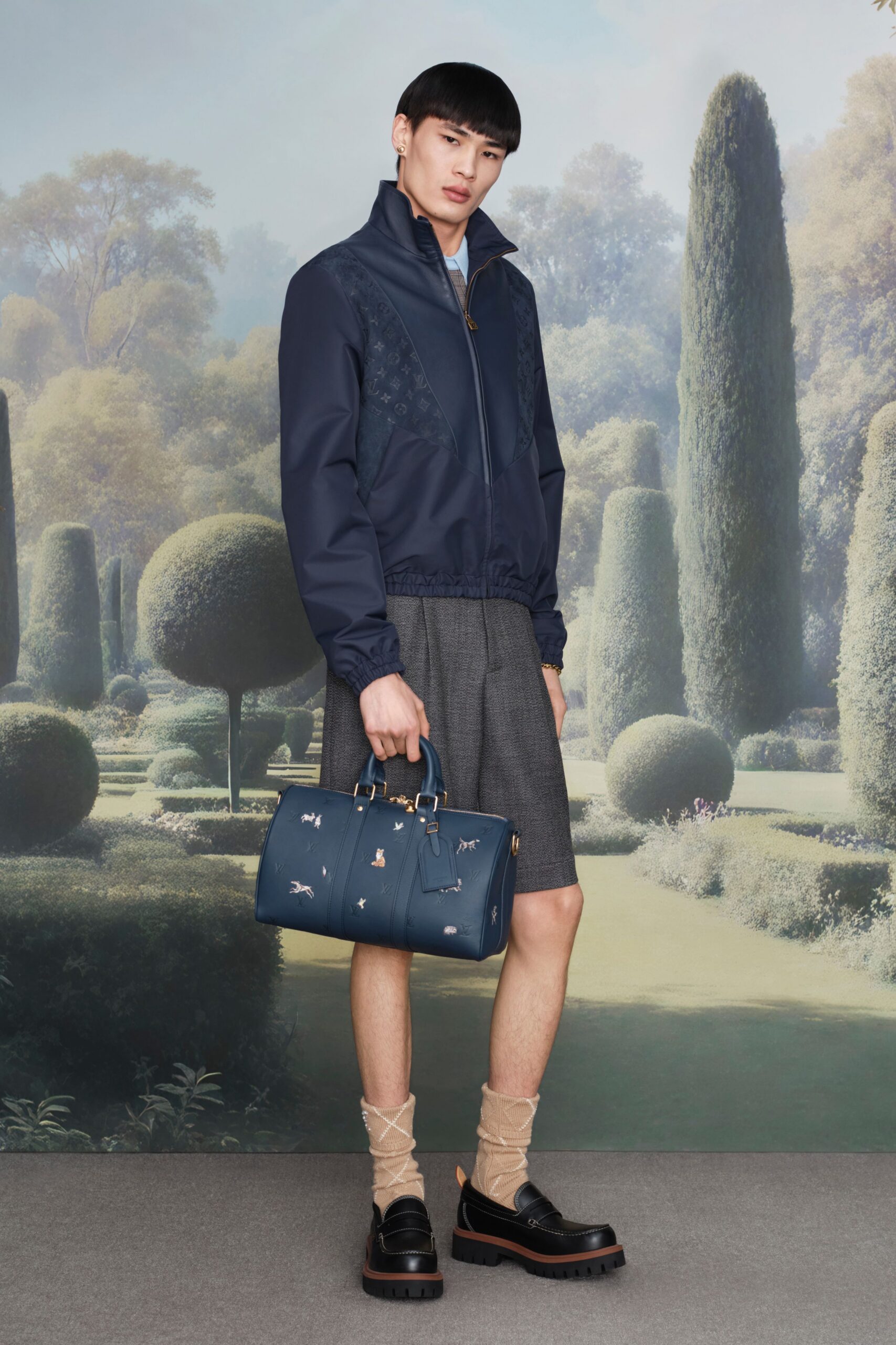 blue fitted jacket with gray shorts