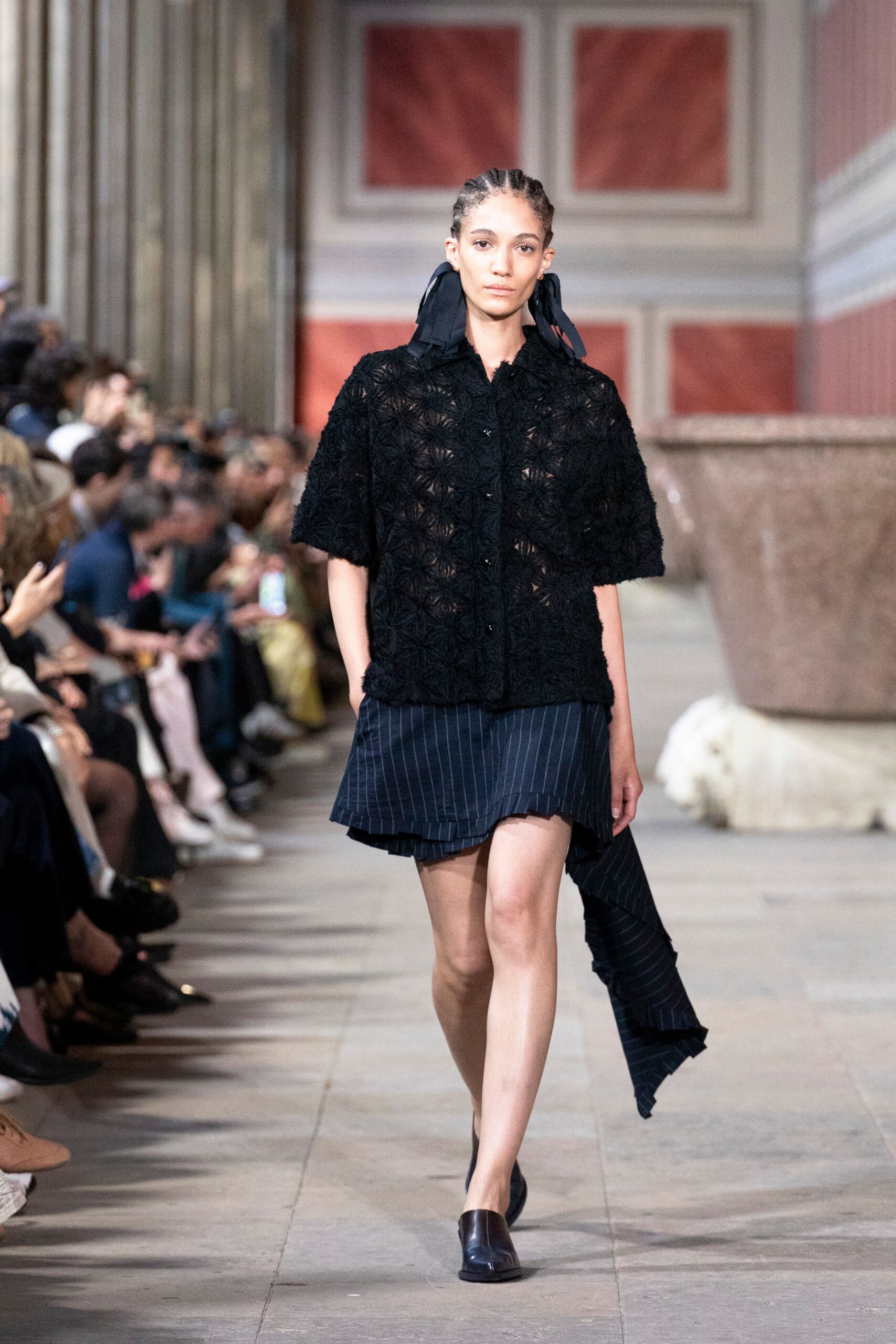 black embroidered top with blue skirt