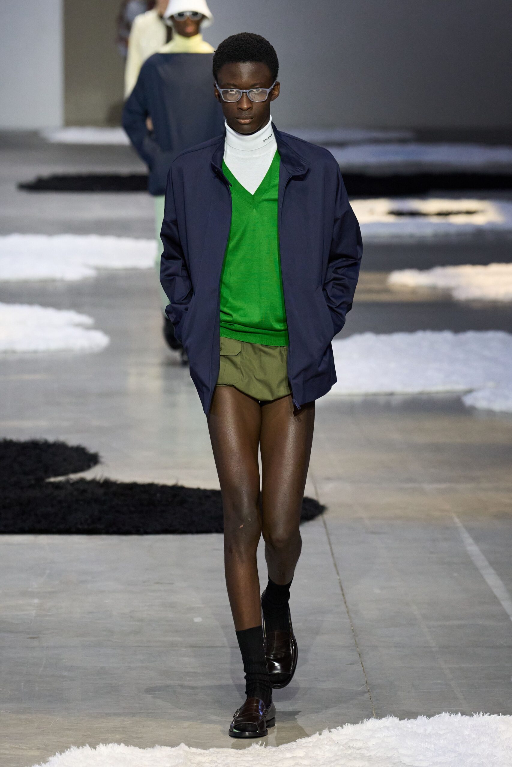 navy jacket green sweater shorts