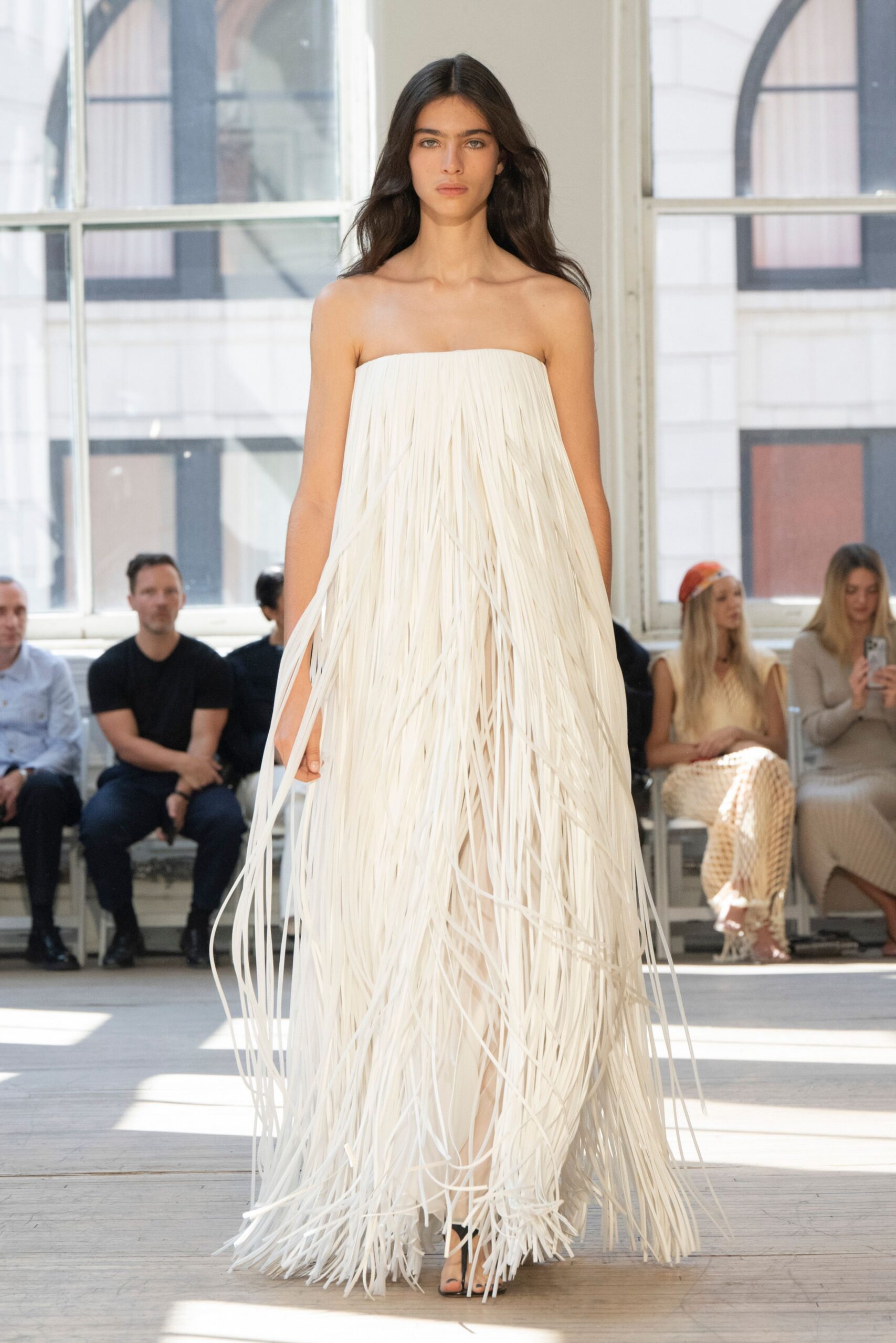 white strapless fringed gown
