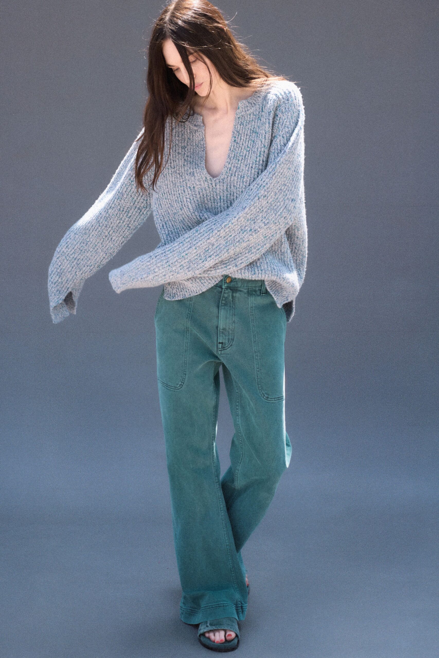 gray oversized sweater with teal pants