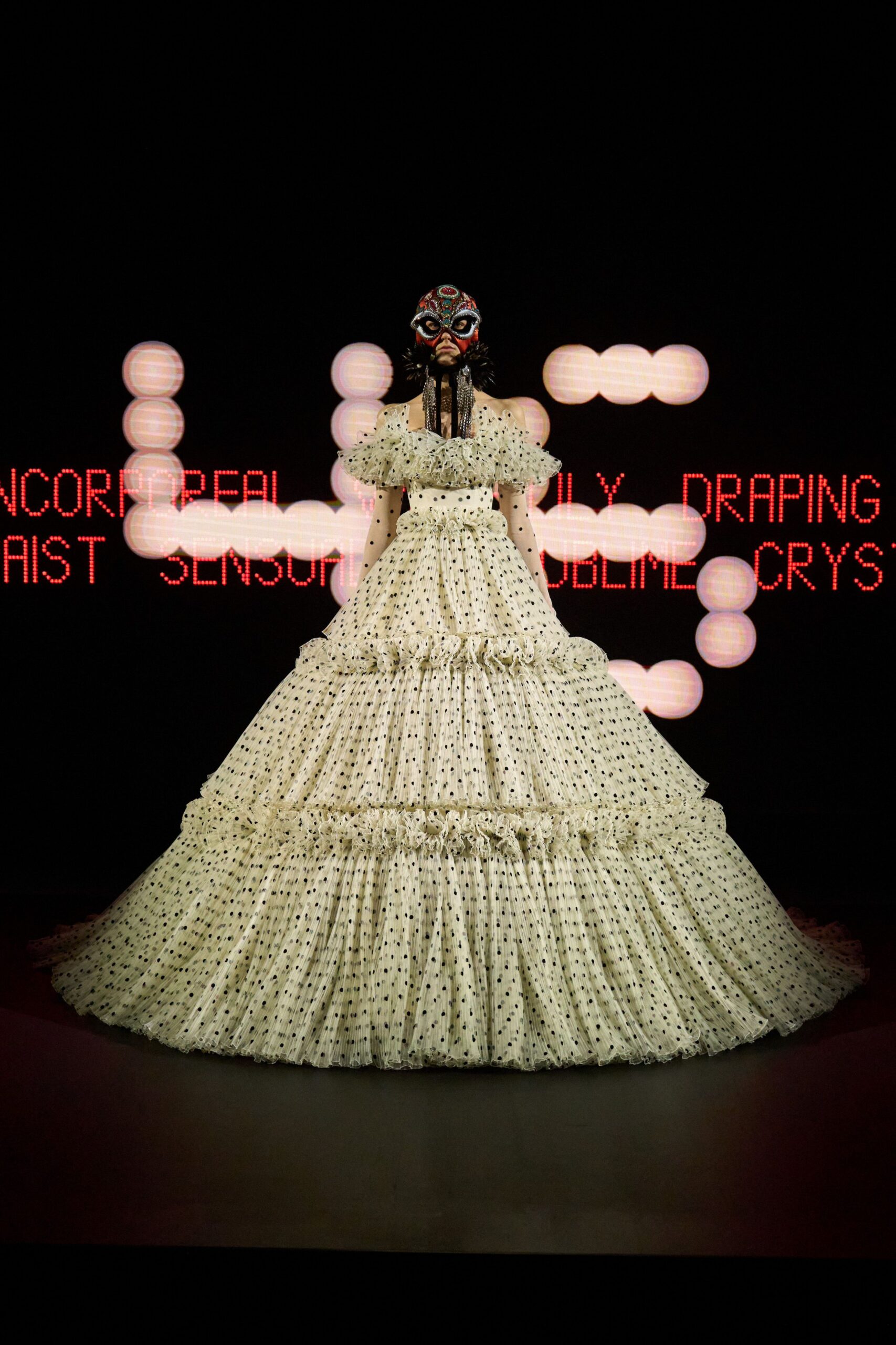 white polka-dot tiered gown