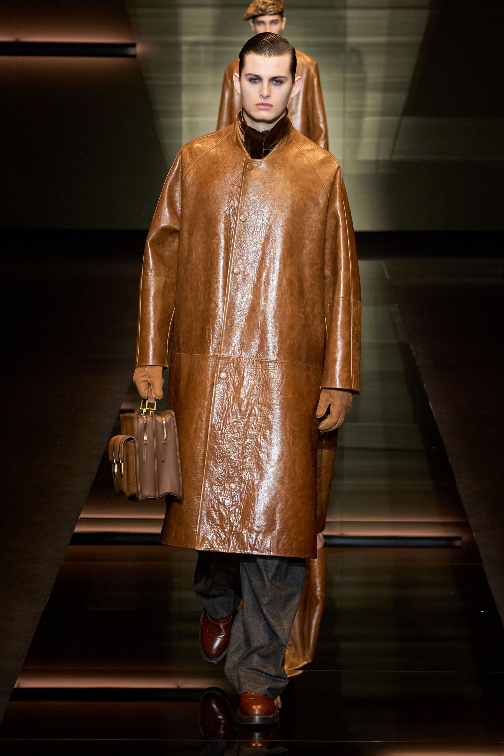 brown leather coat with gray pants