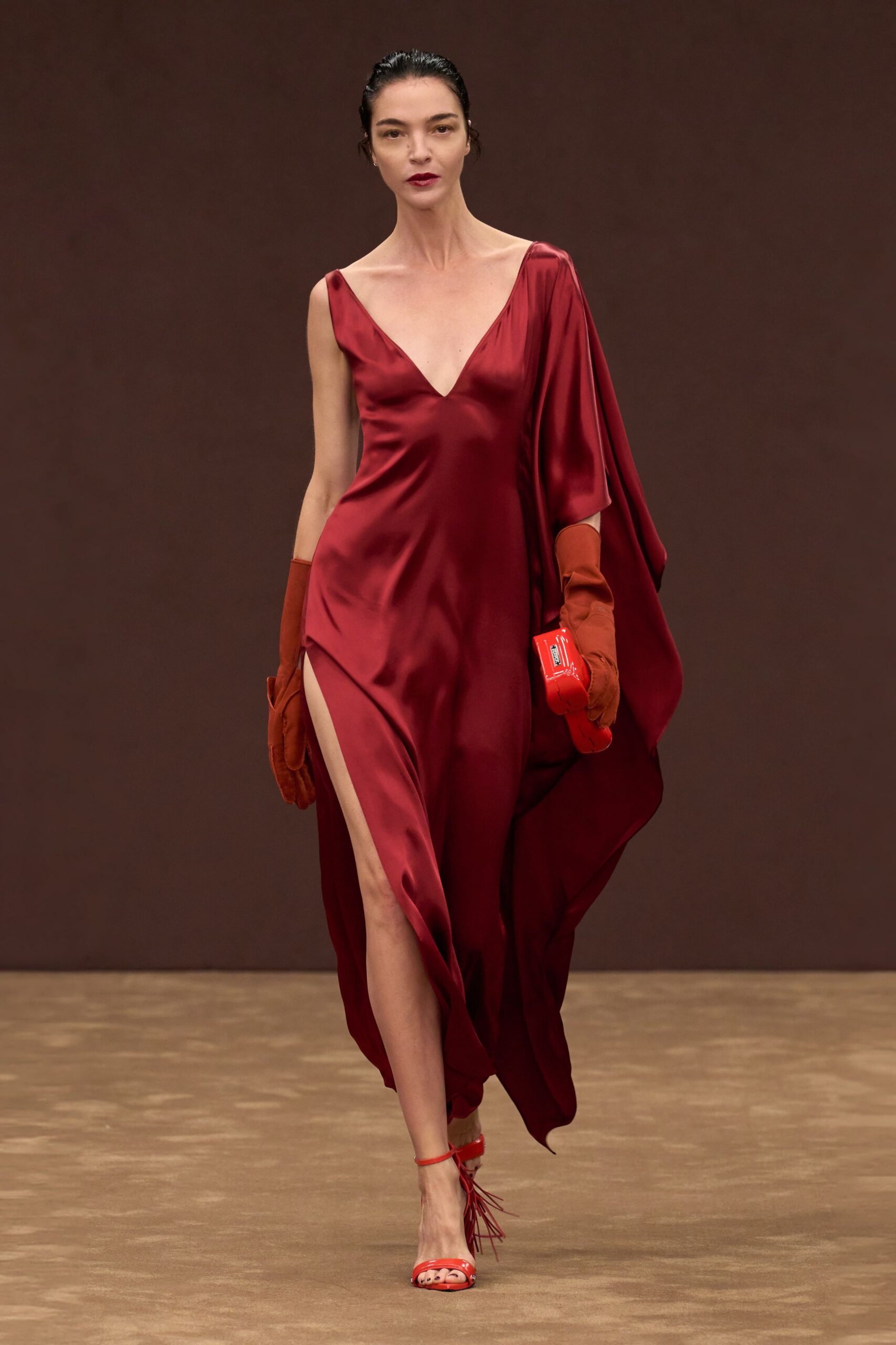 red silk sleeveless v-neck fitted draped flowing gown