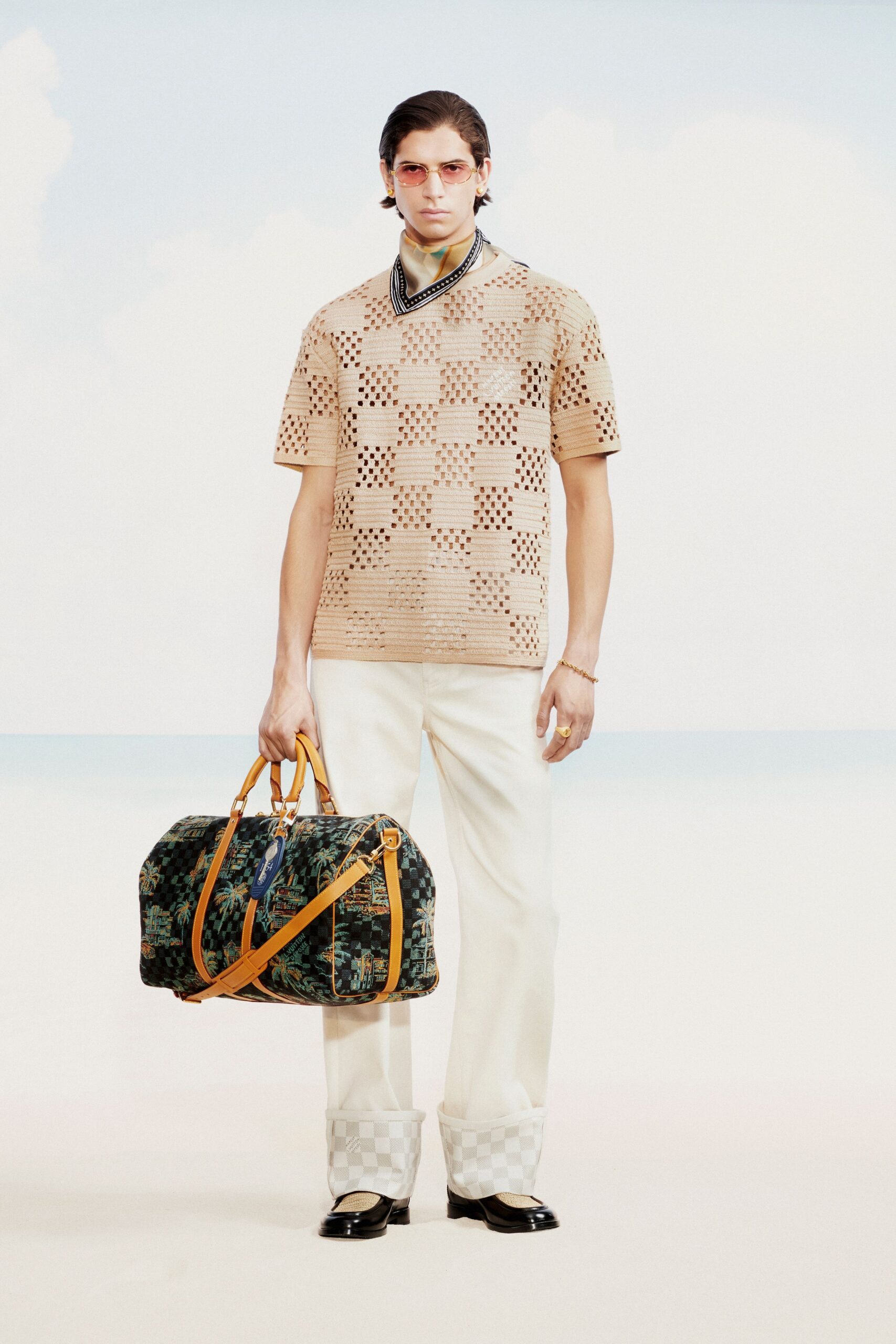 beige embroidered top with white pants