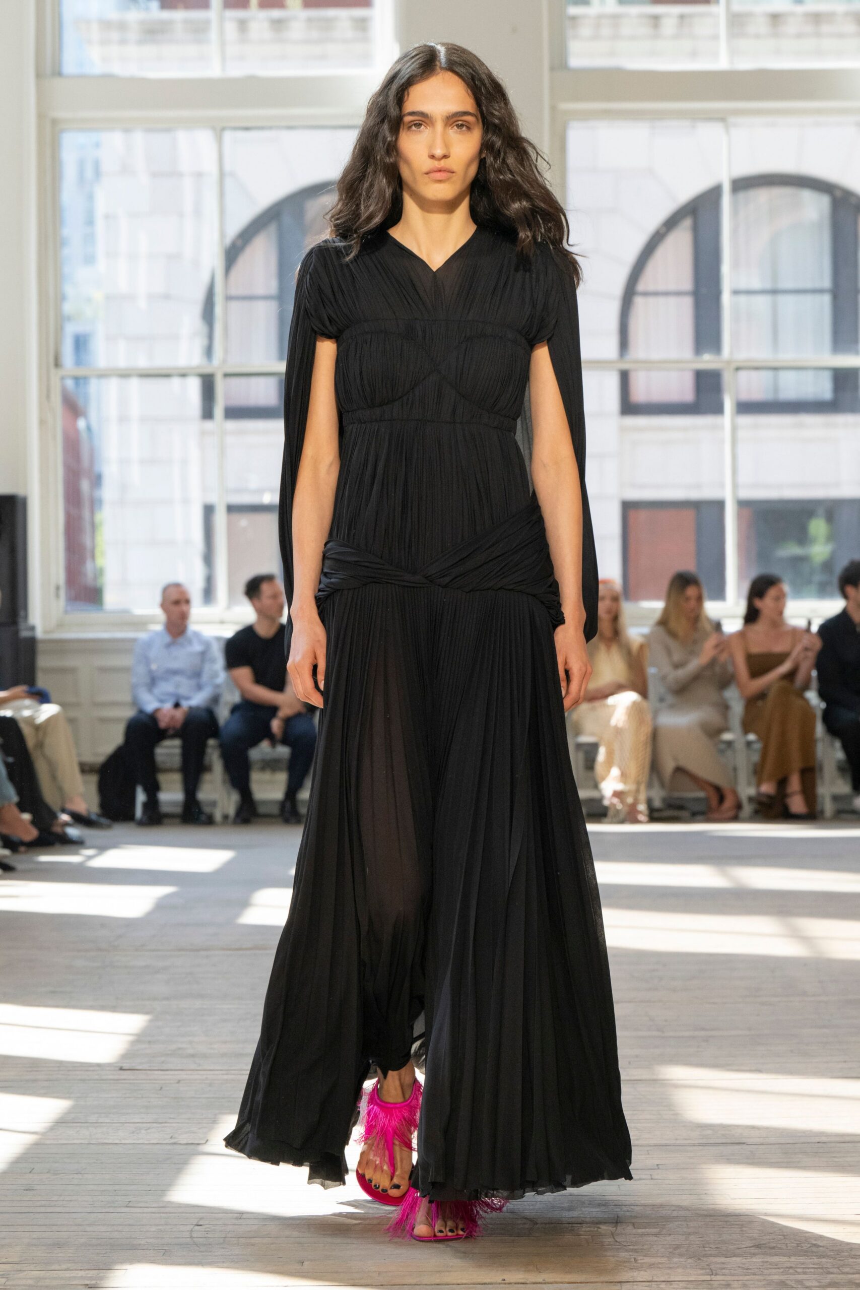 black silk pleated gown with pink shoes