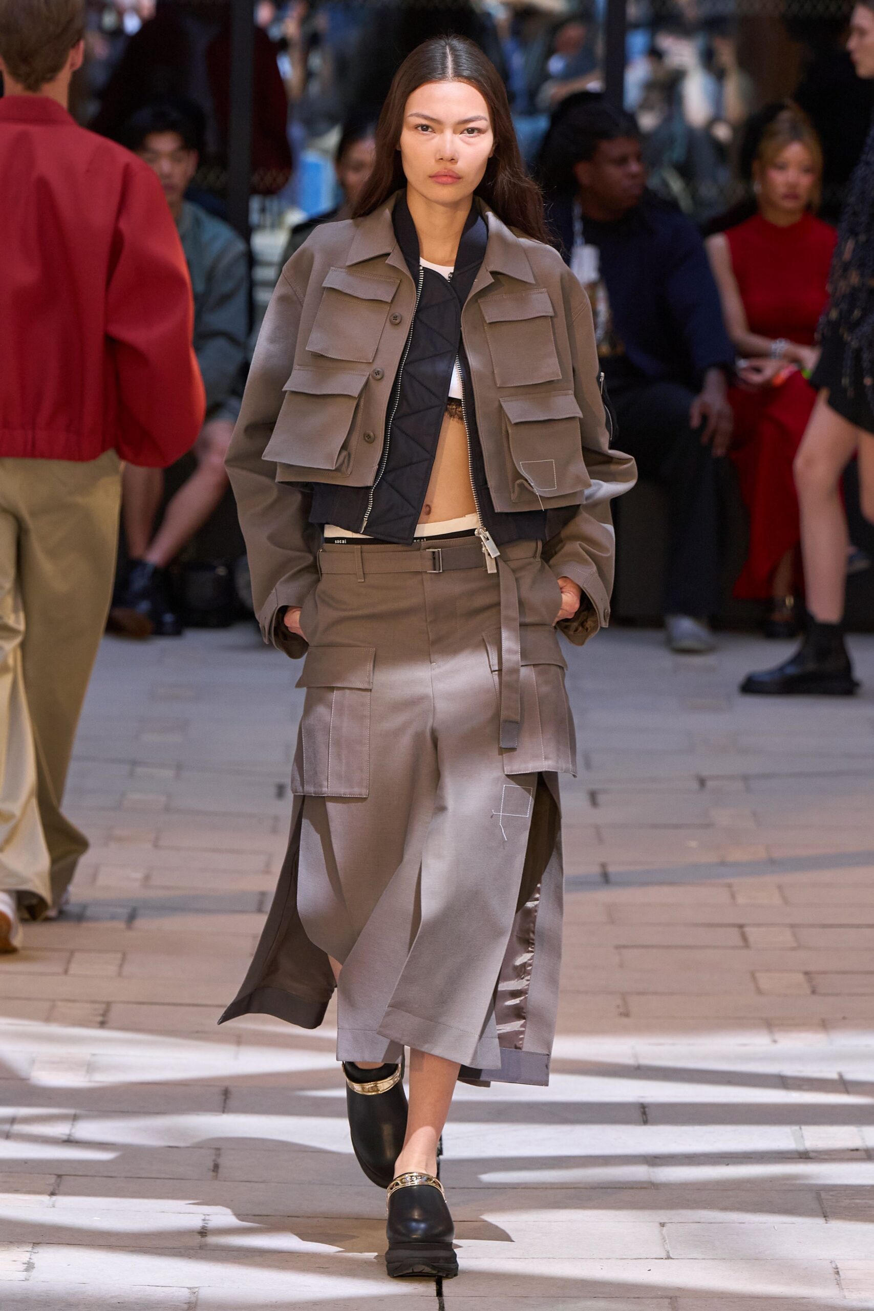 gray jacket black top gray skirt
