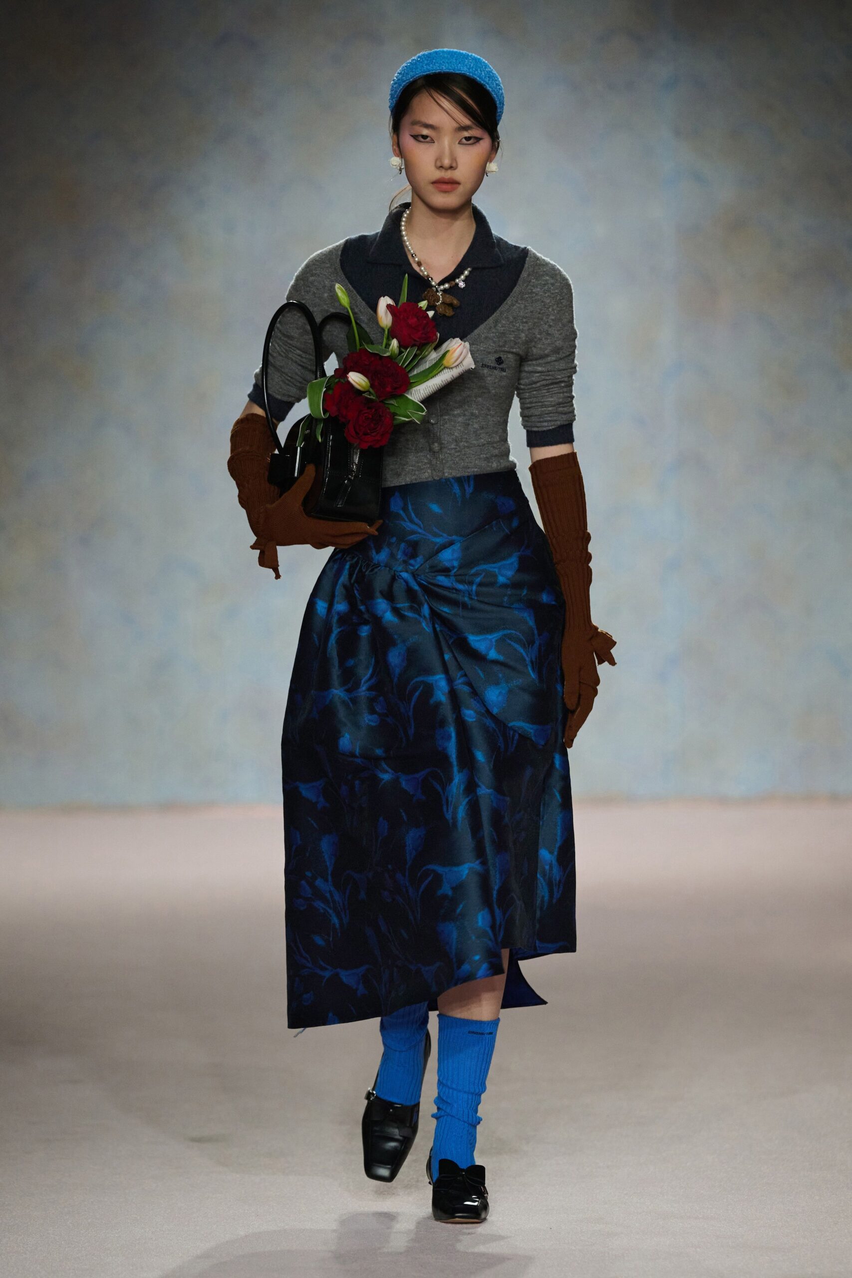 gray fitted top with blue skirt