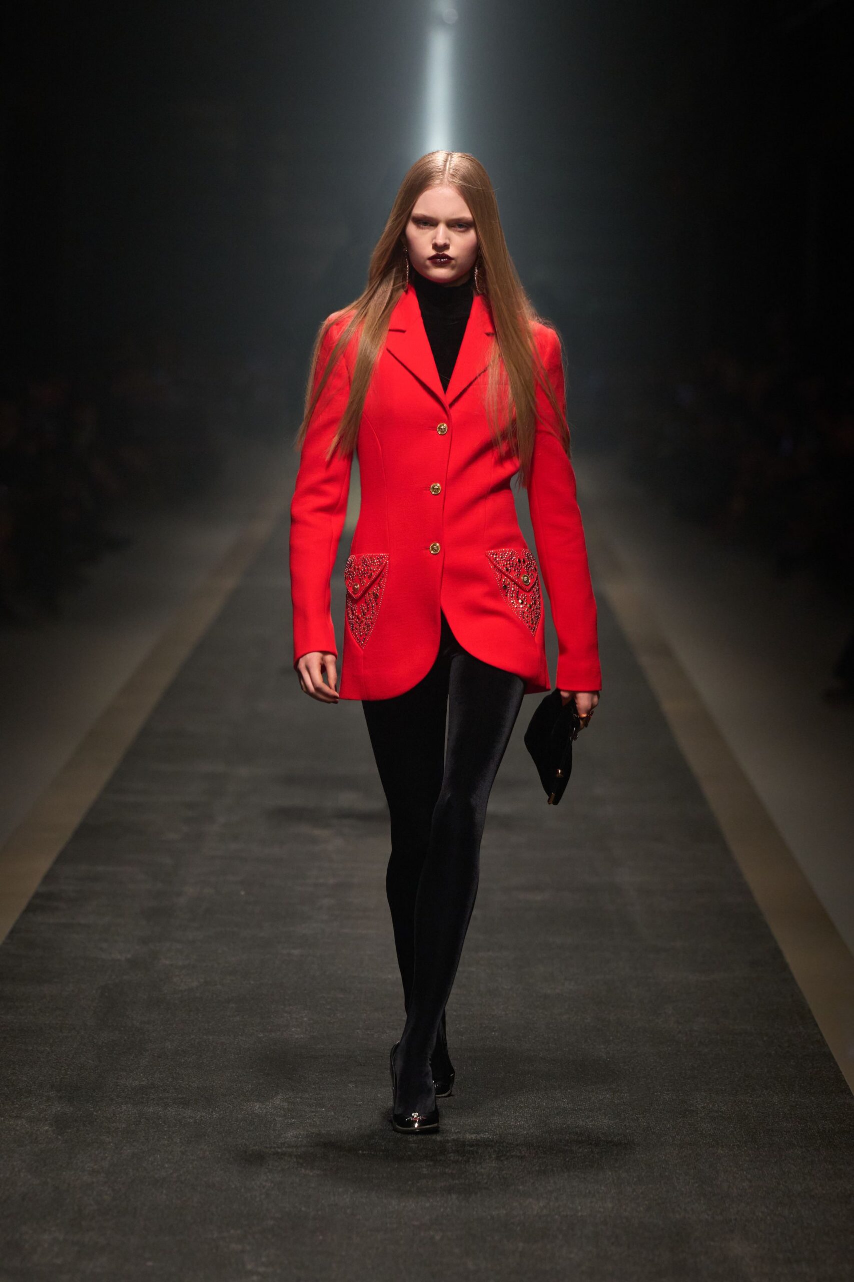 red tailored blazer with black pants