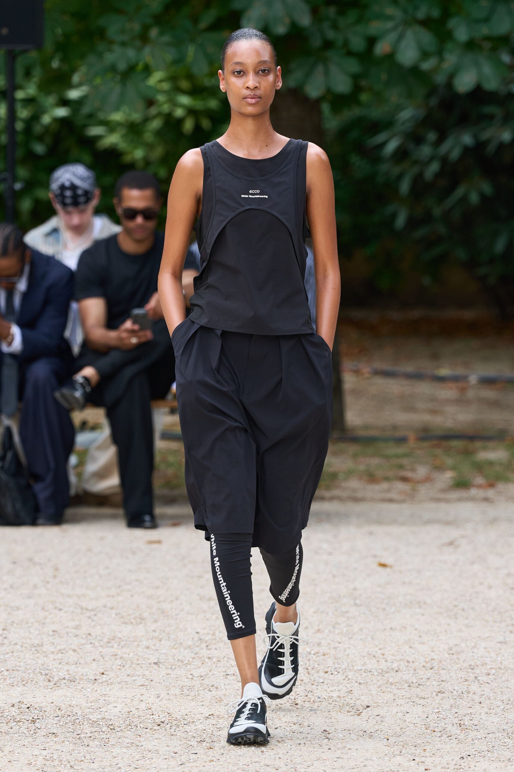 black sleeveless top and relaxed pants