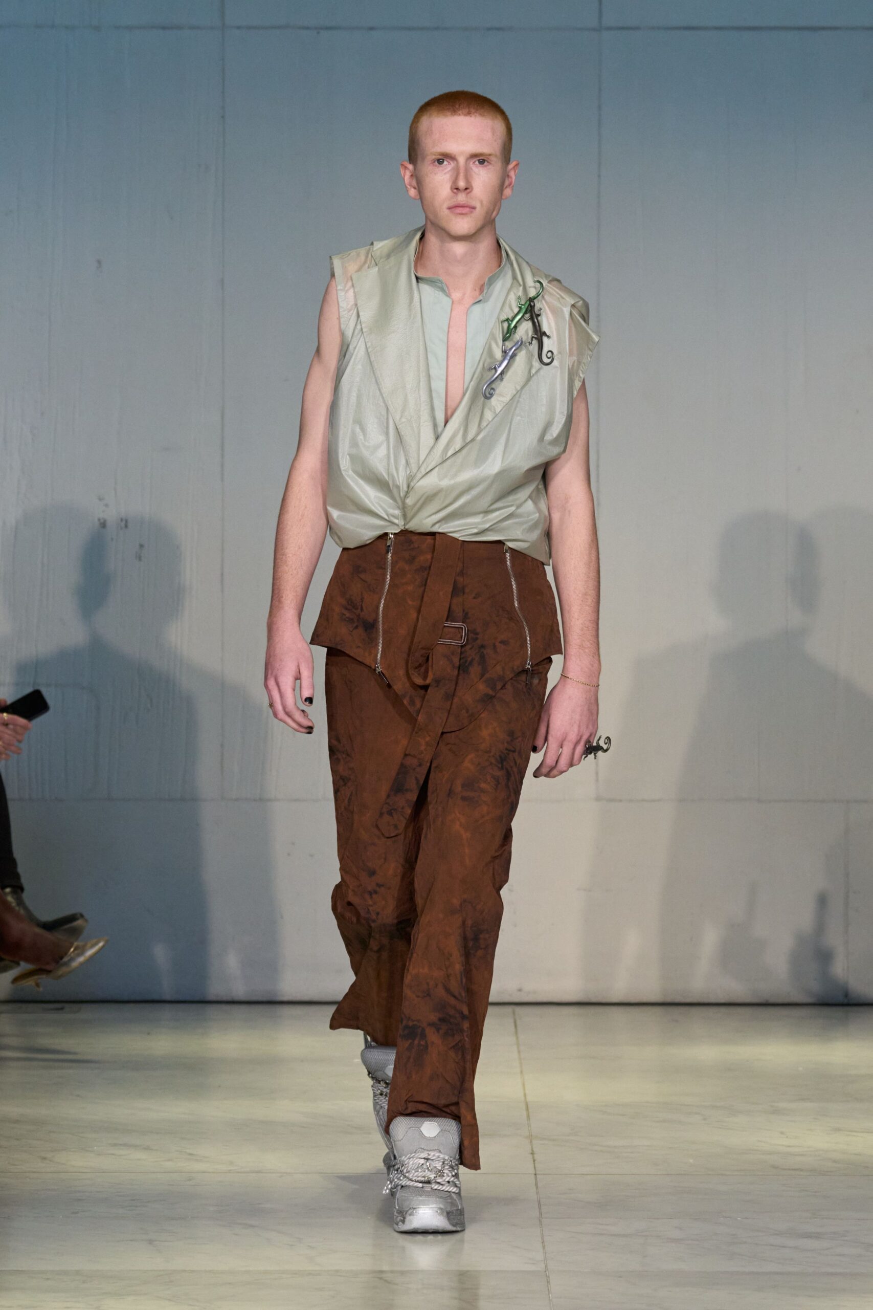 green relaxed top with brown pants
