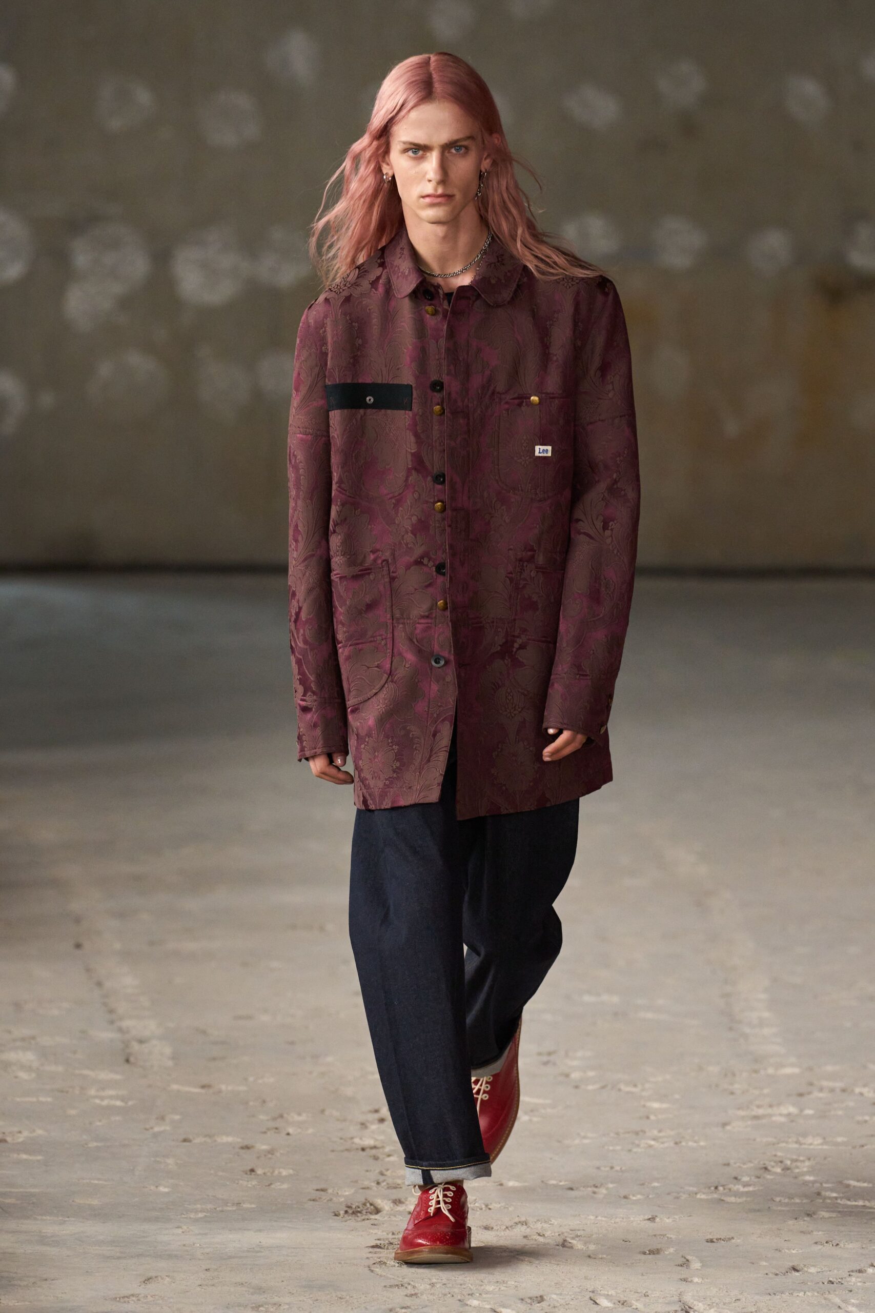 maroon printed shirt with blue jeans