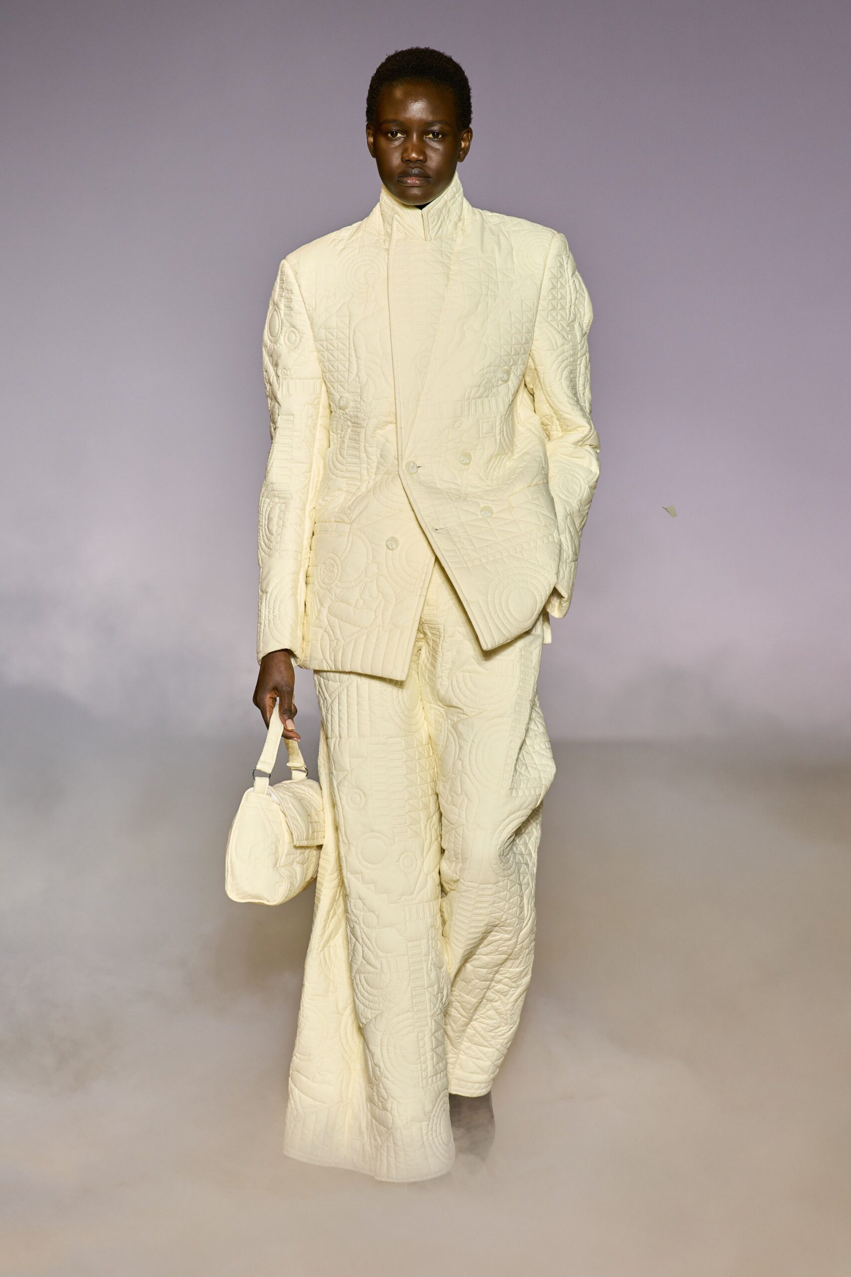 white tailored suit with bag