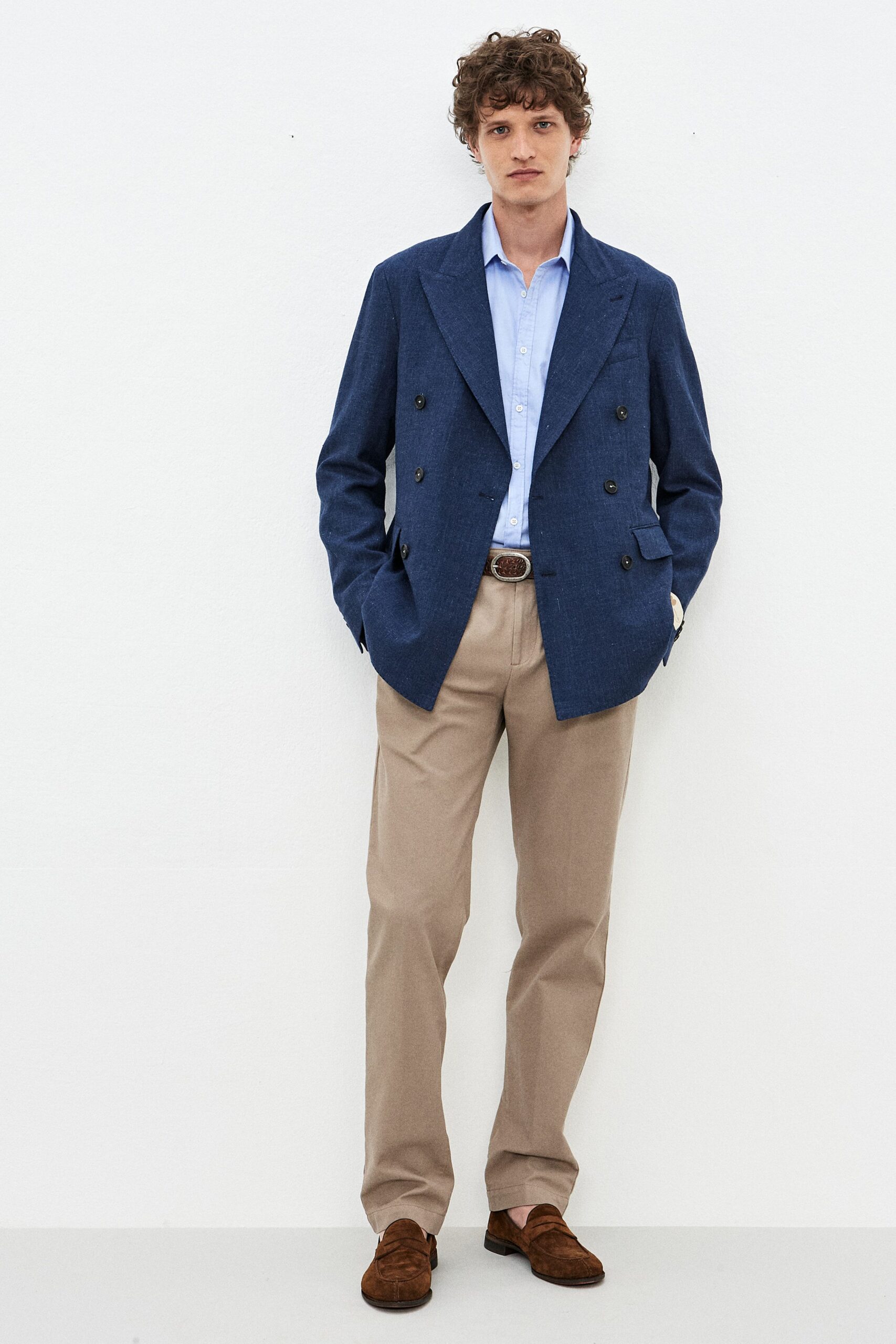 blue blazer with beige pants