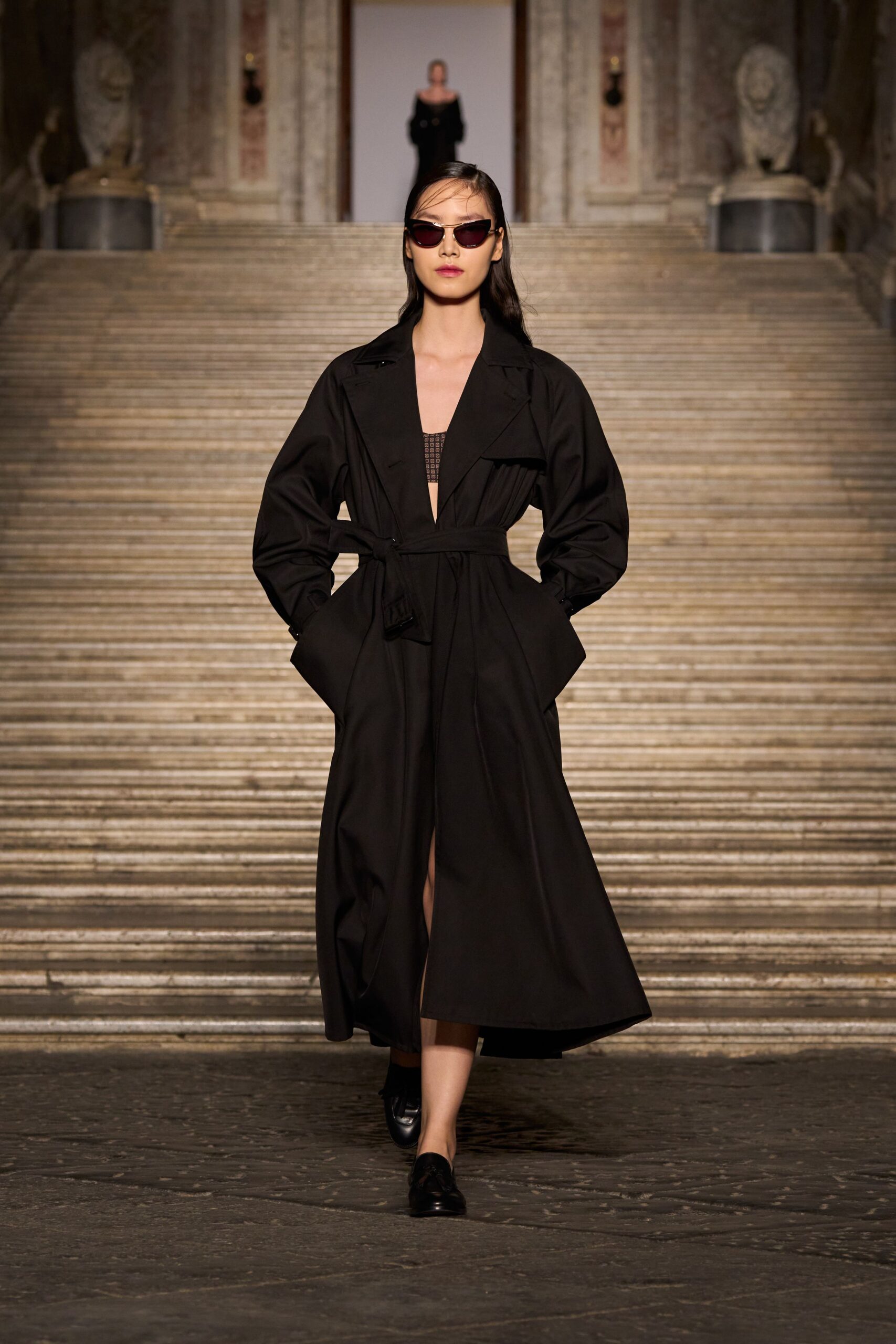 black relaxed coat with sunglasses