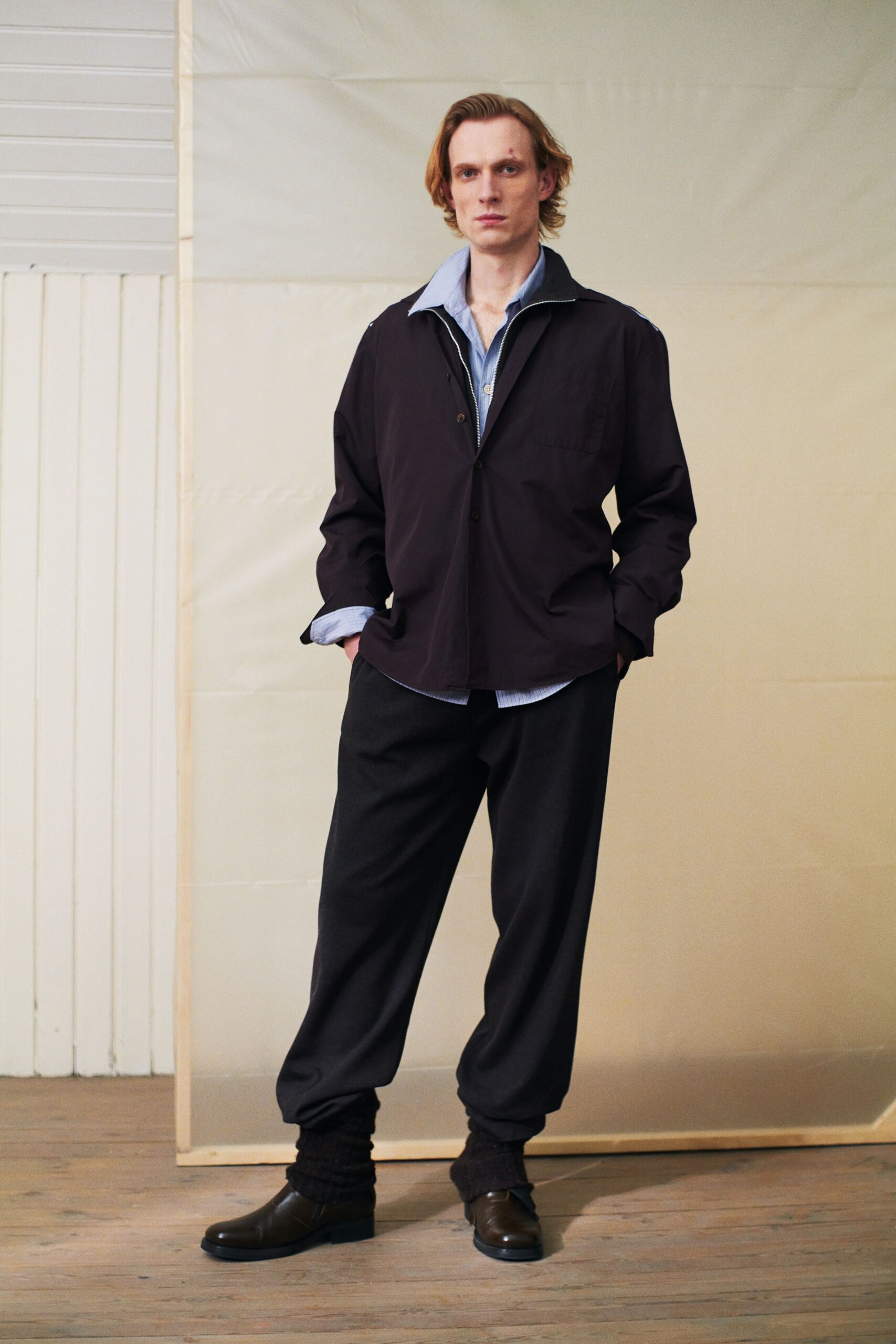 black jacket with blue shirt