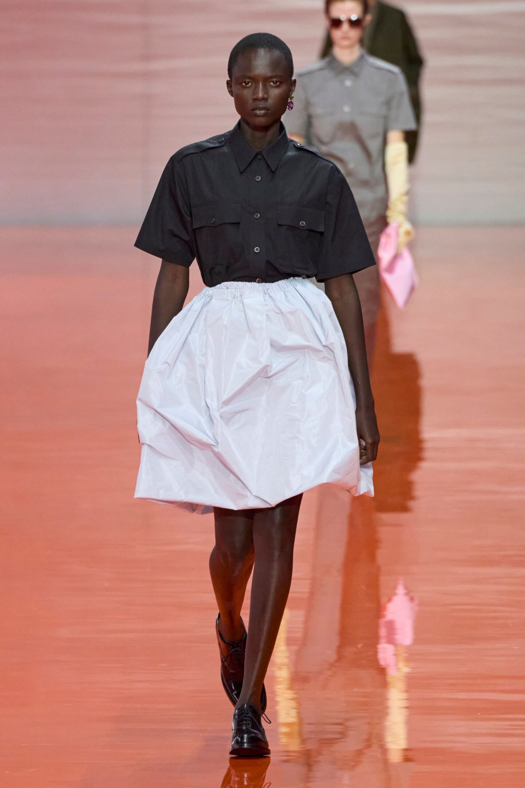 black shirt white pleated skirt