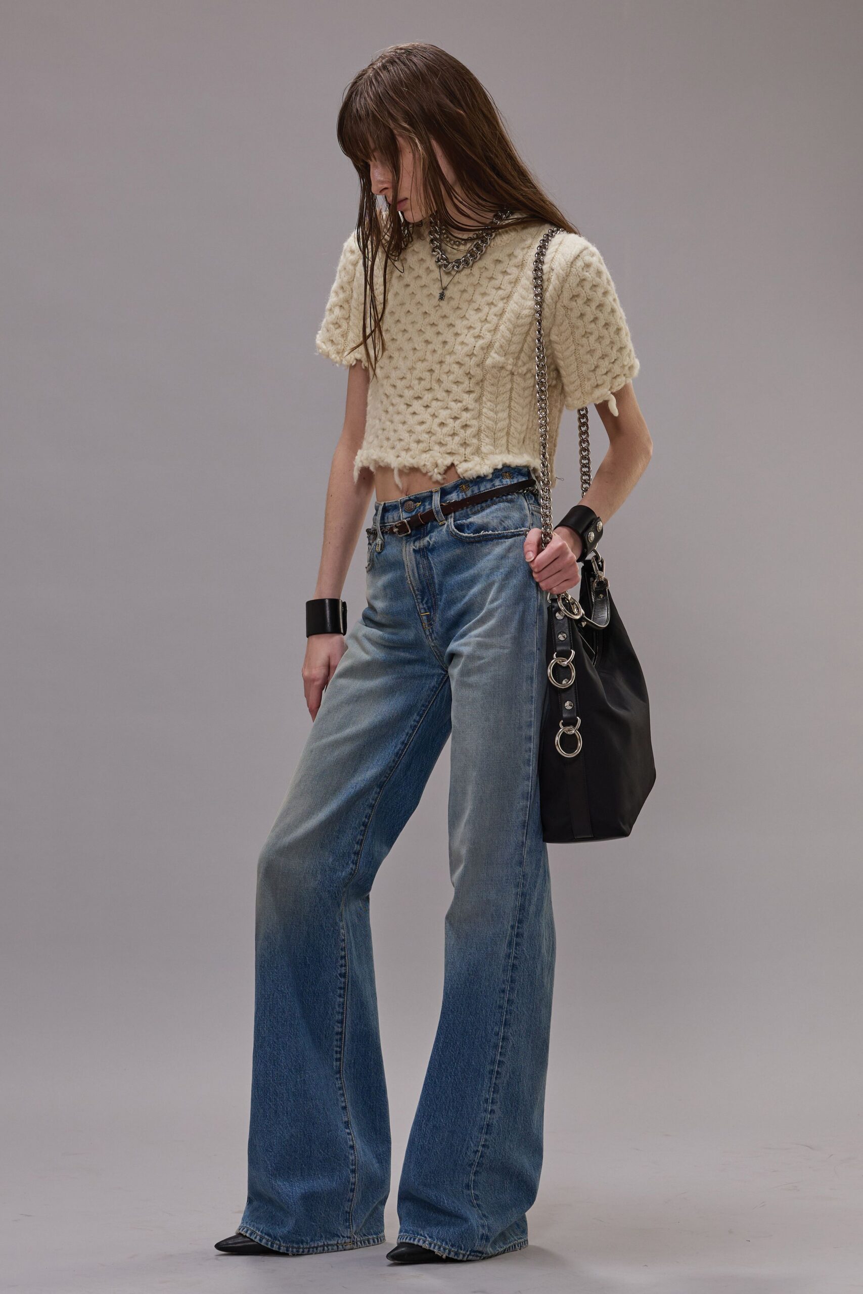 beige cropped top with blue jeans