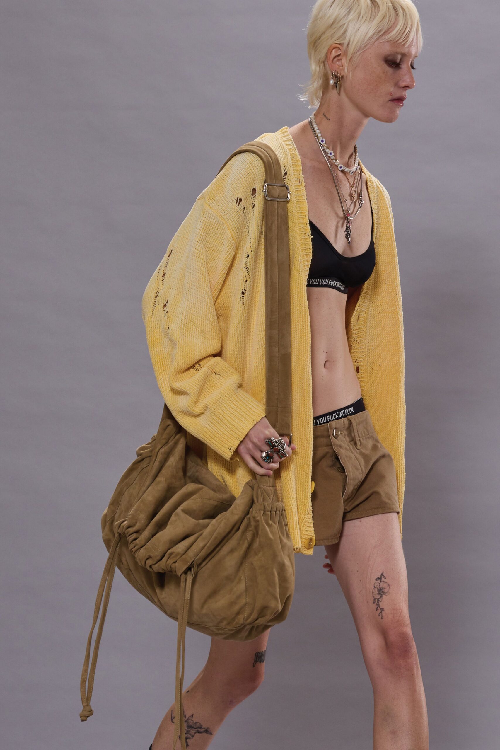 yellow cardigan with brown shorts