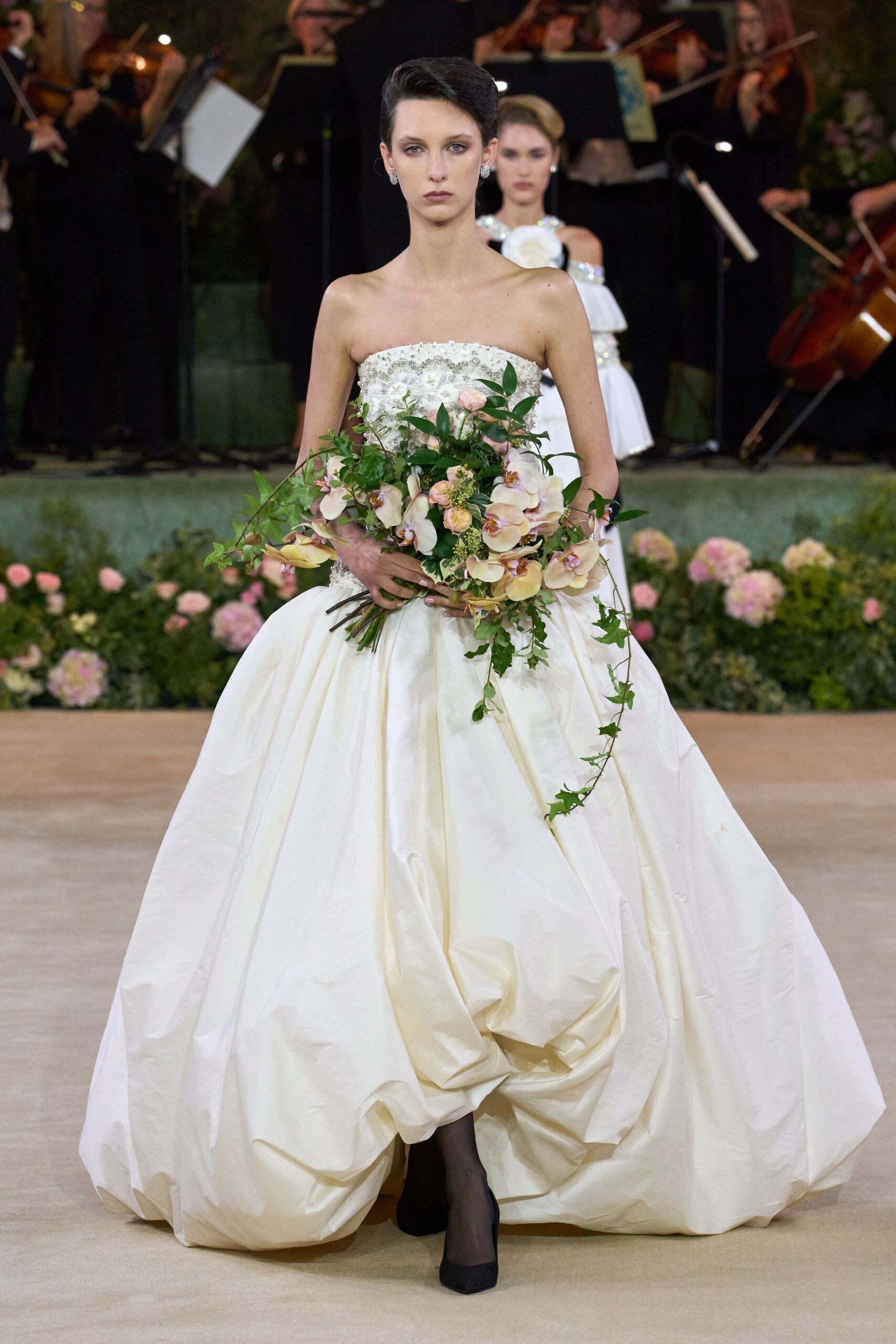white silk strapless fitted pleated layered maxi gown