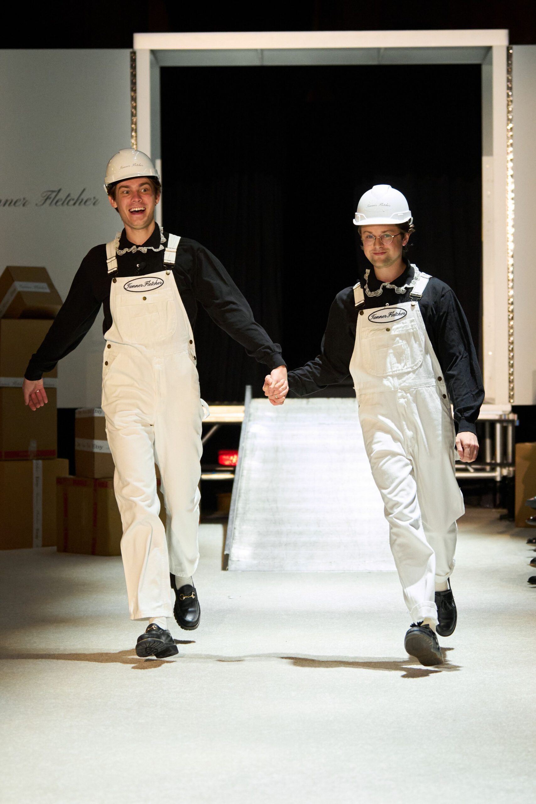 white overalls black shirt