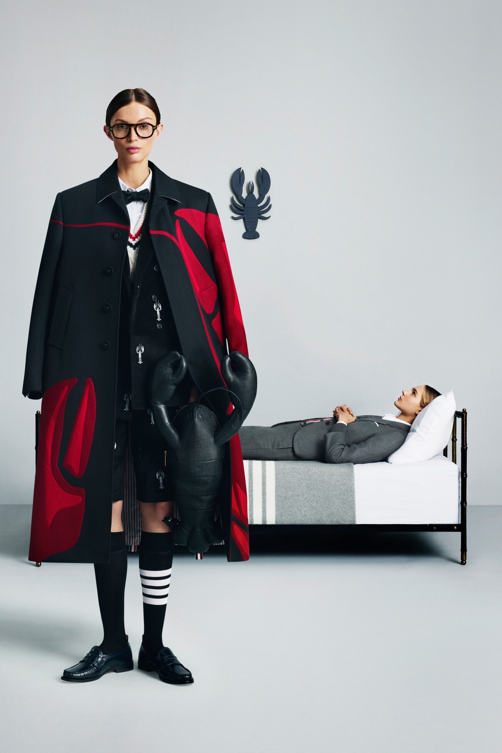 oversized black and red coat with pleated skirt