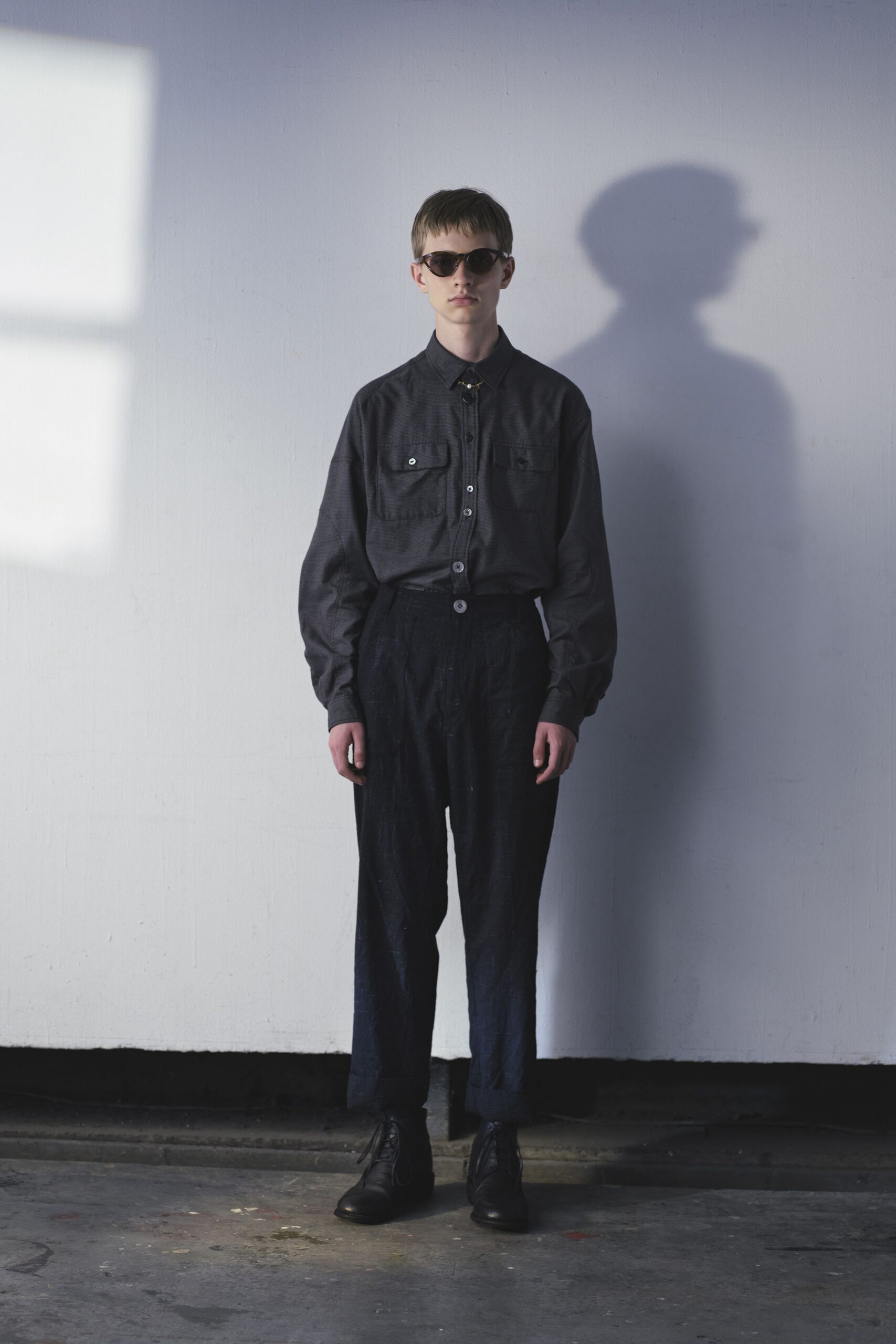 black shirt blue pants