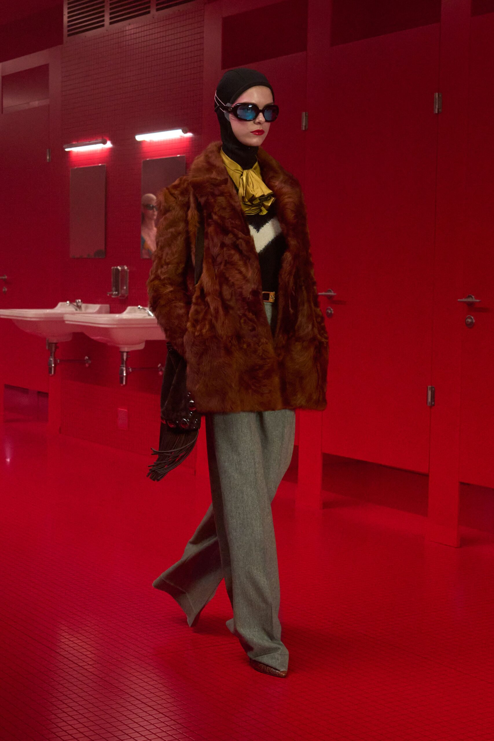 brown faux-fur coat with gray pants