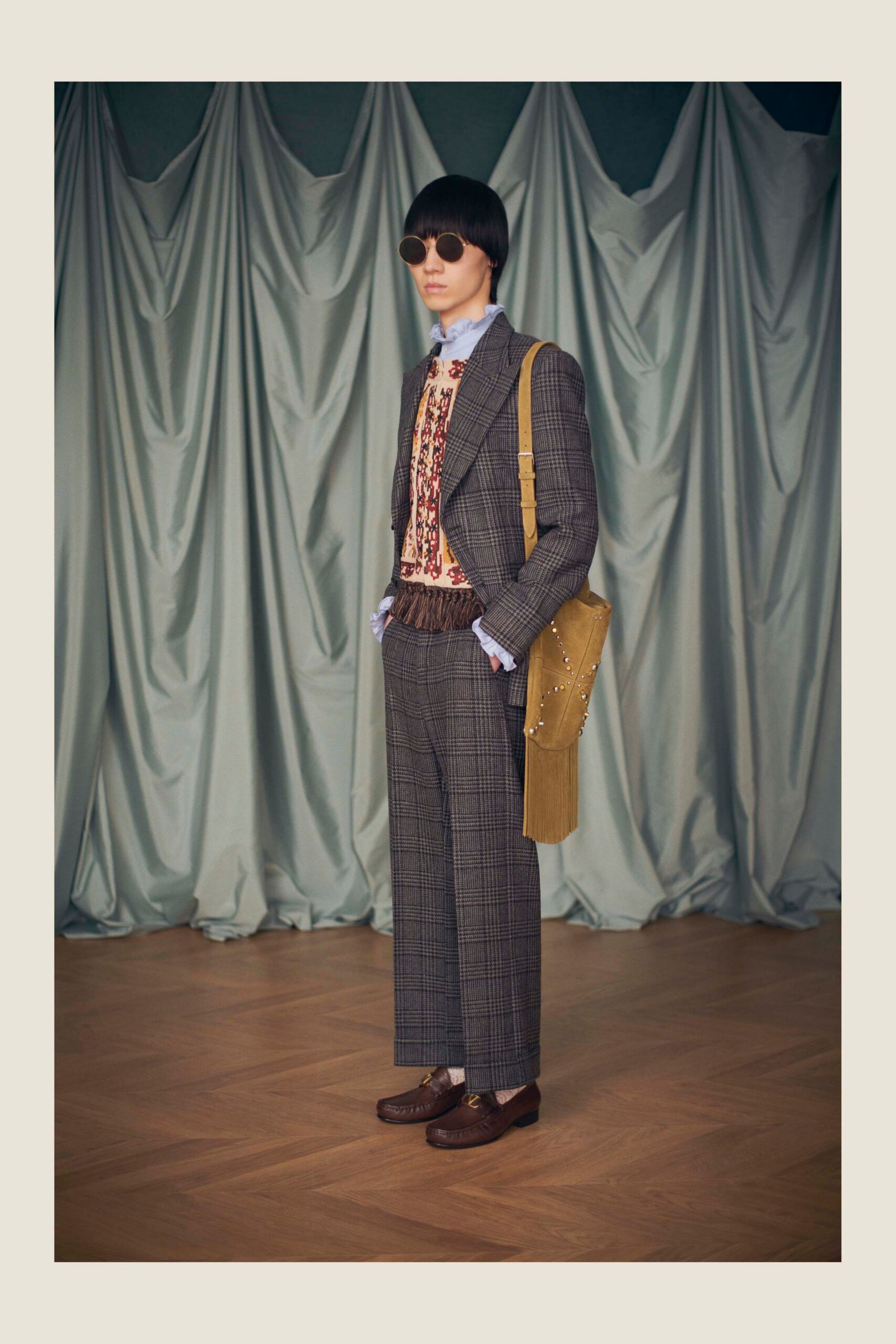 gray tailored suit with red sweater