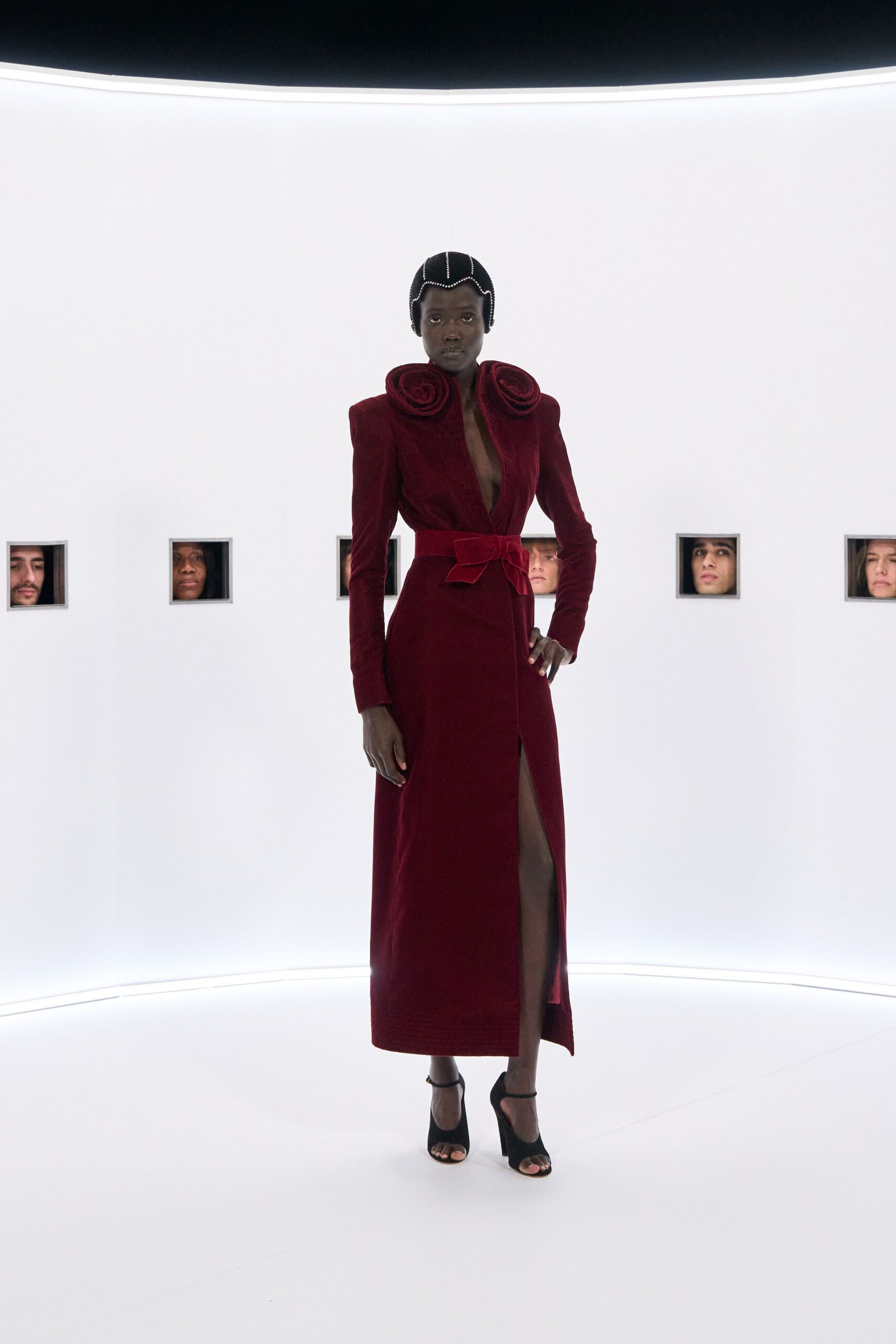 red velvet long-sleeve v-neck fitted belted ruffled gown