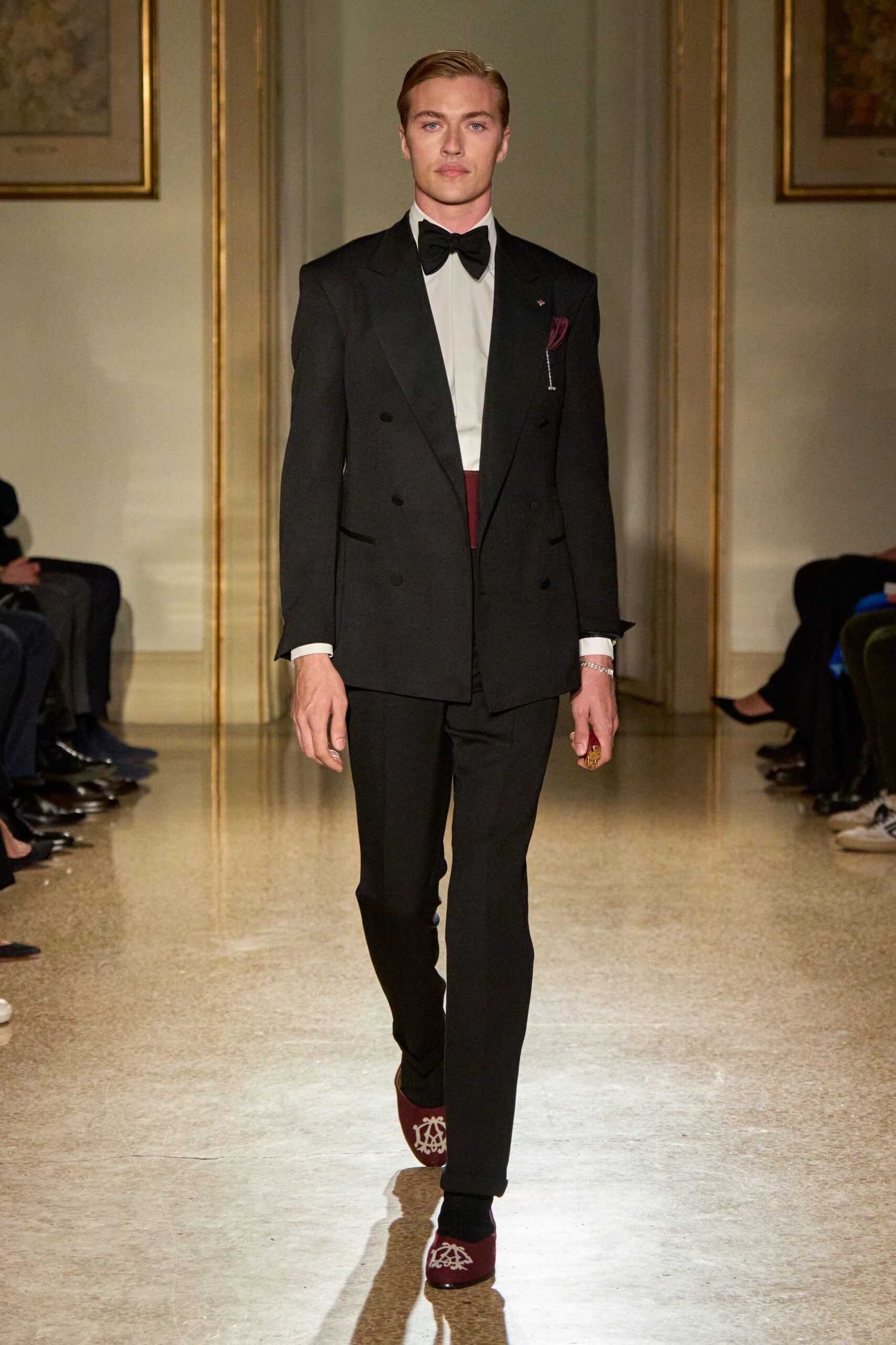 black tailored suit with red shoes
