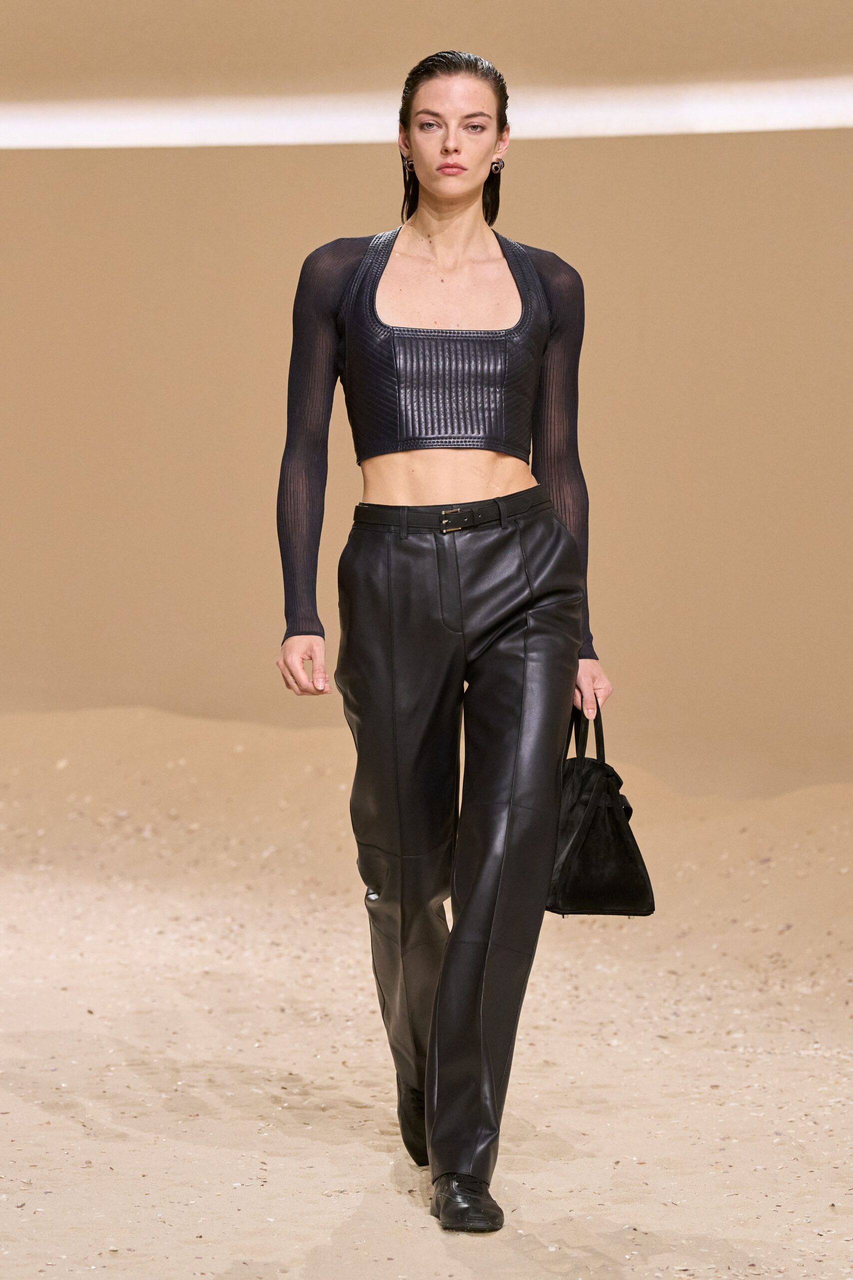 black fitted cropped top with leather pants