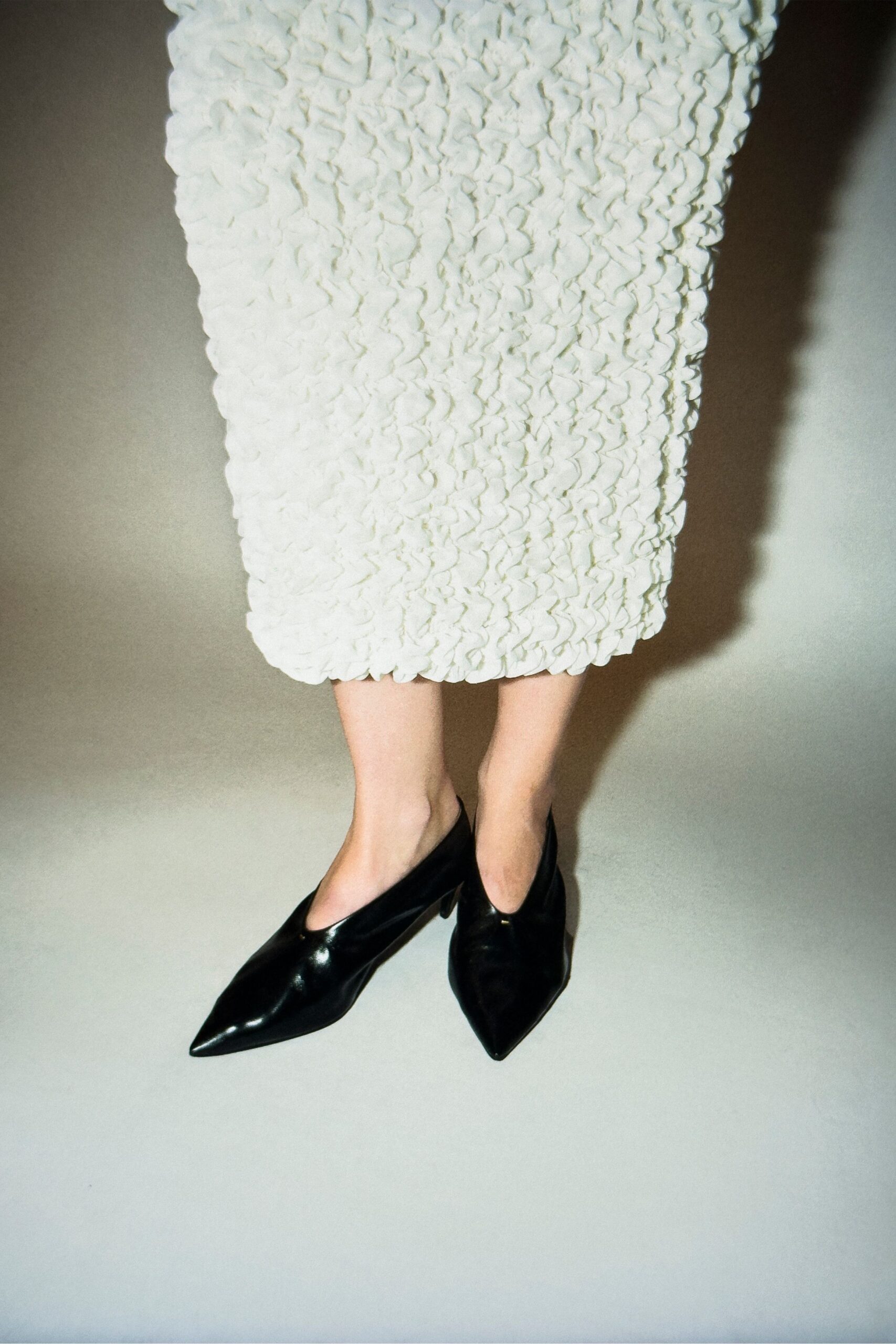 white cotton long-sleeve fitted ruffled midi skirt