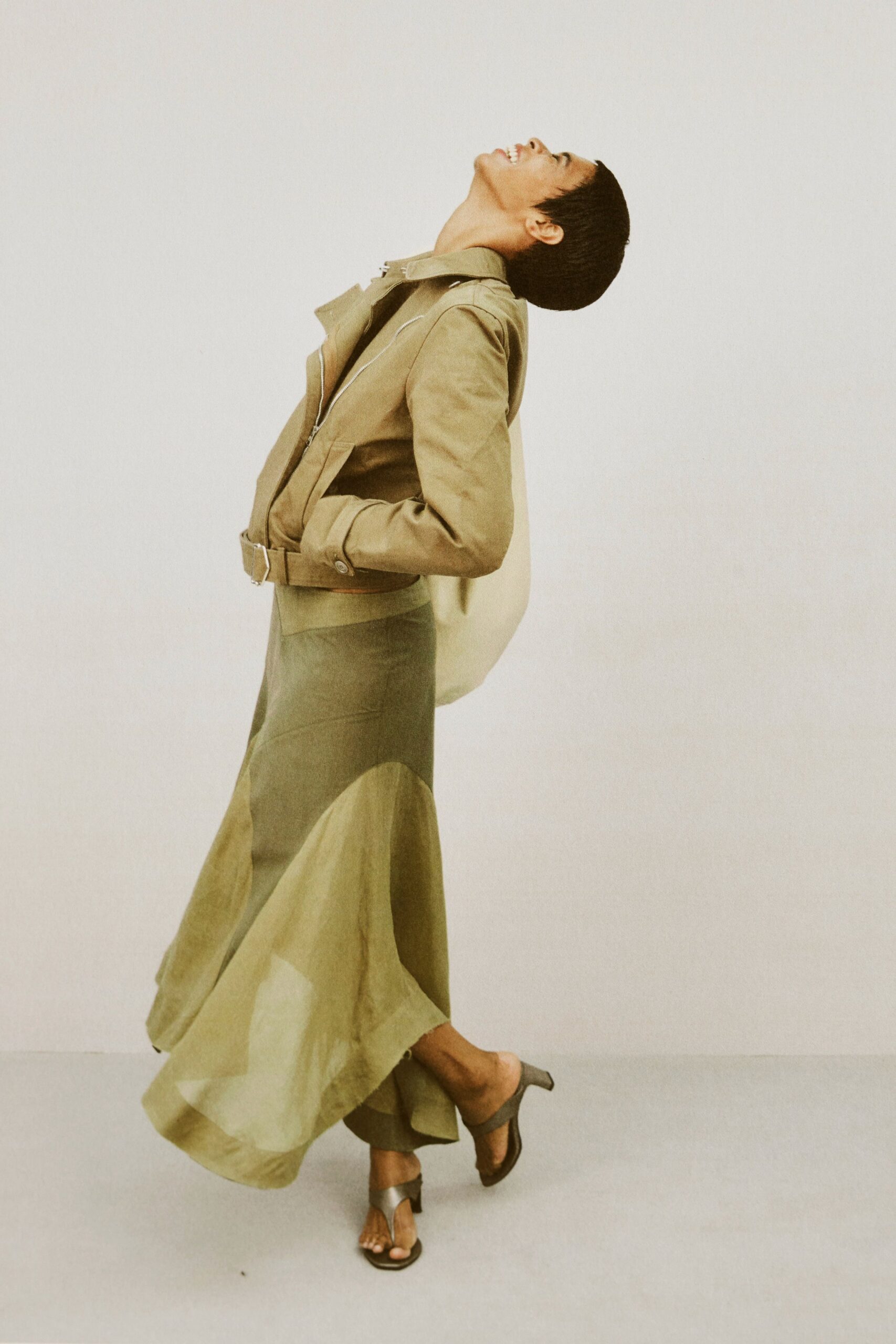 beige jacket green flared skirt
