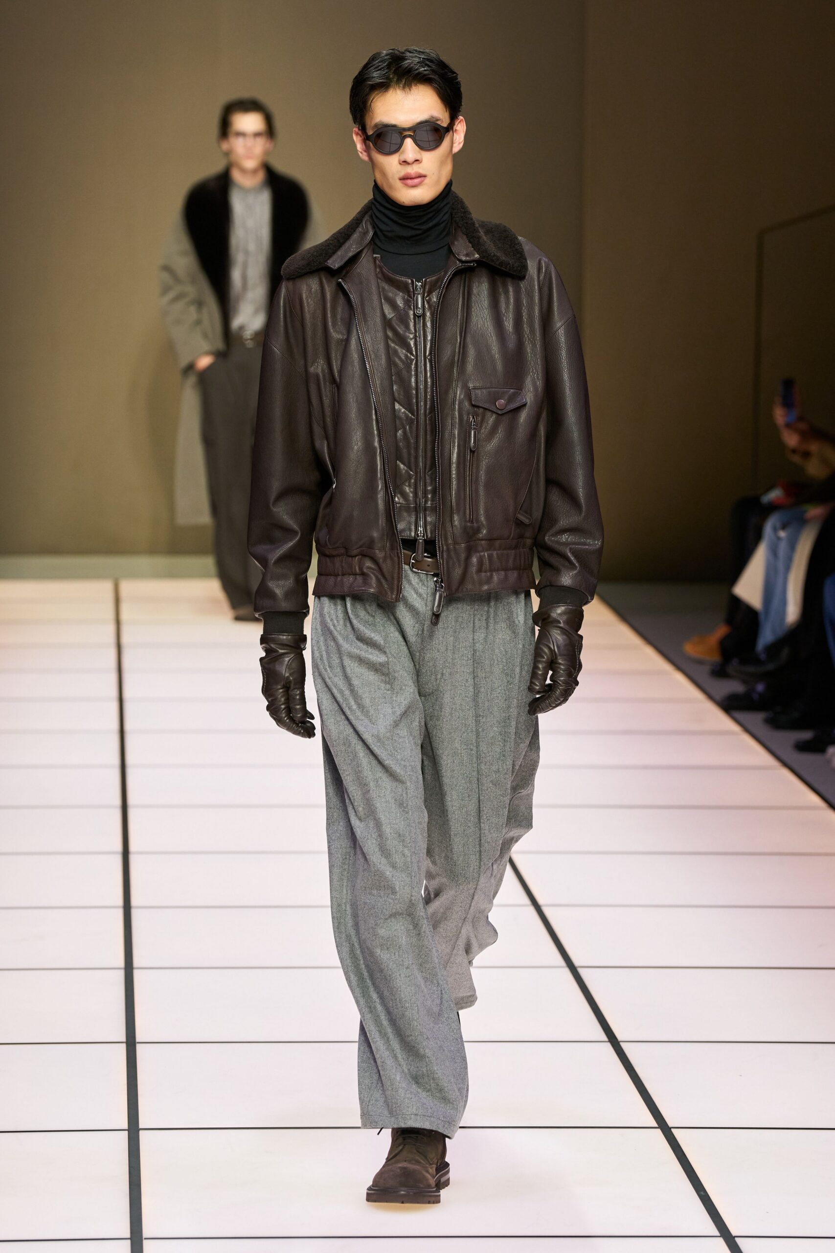 brown leather jacket with black turtleneck