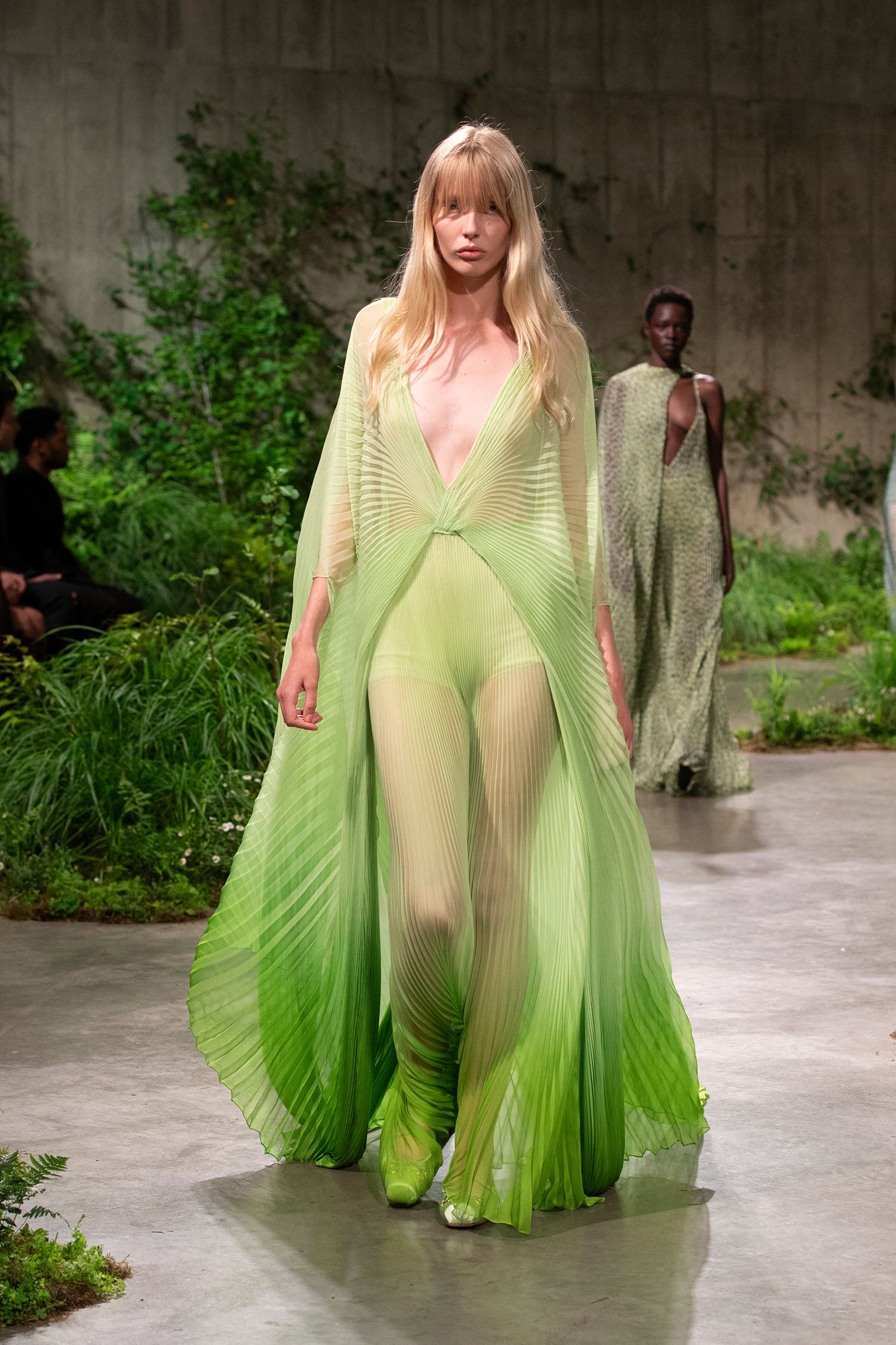 green silk sleeveless v-neck fitted pleated flowing gown