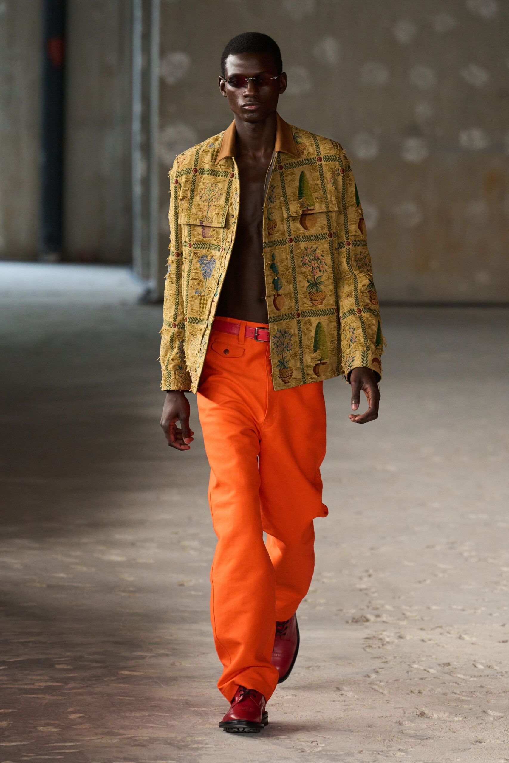 yellow embroidered jacket with orange pants