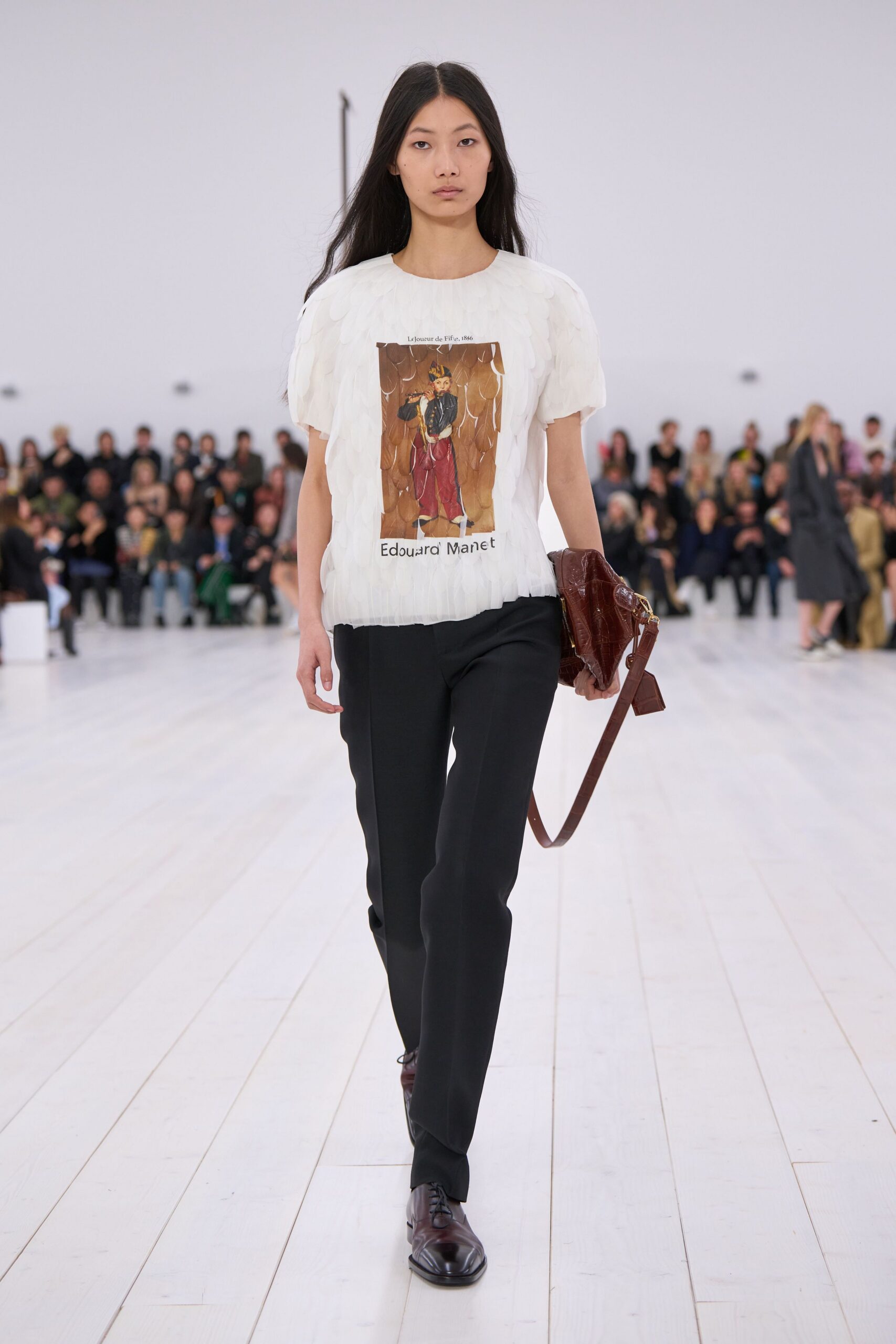 white pleated top with black pants