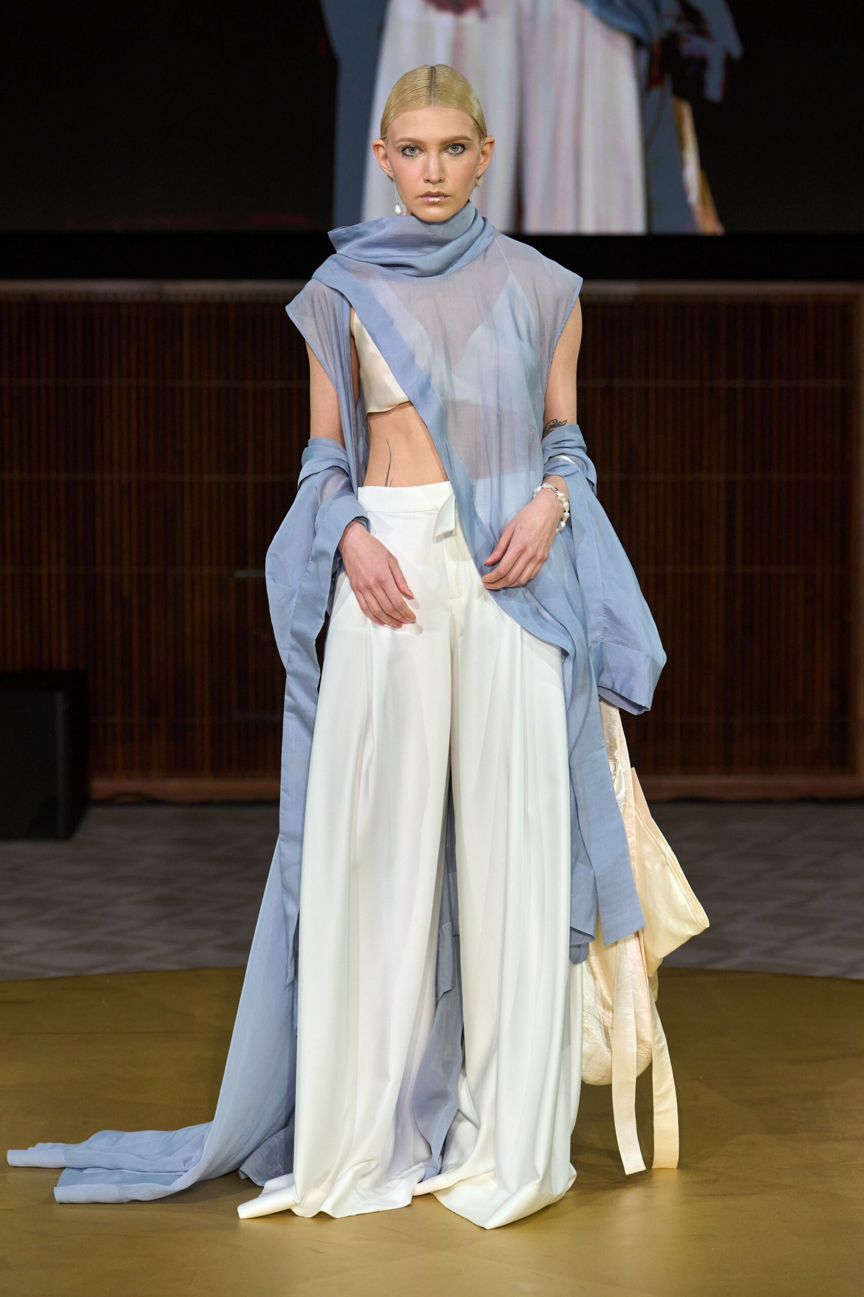 blue chiffon sleeveless top and white wide-leg pants