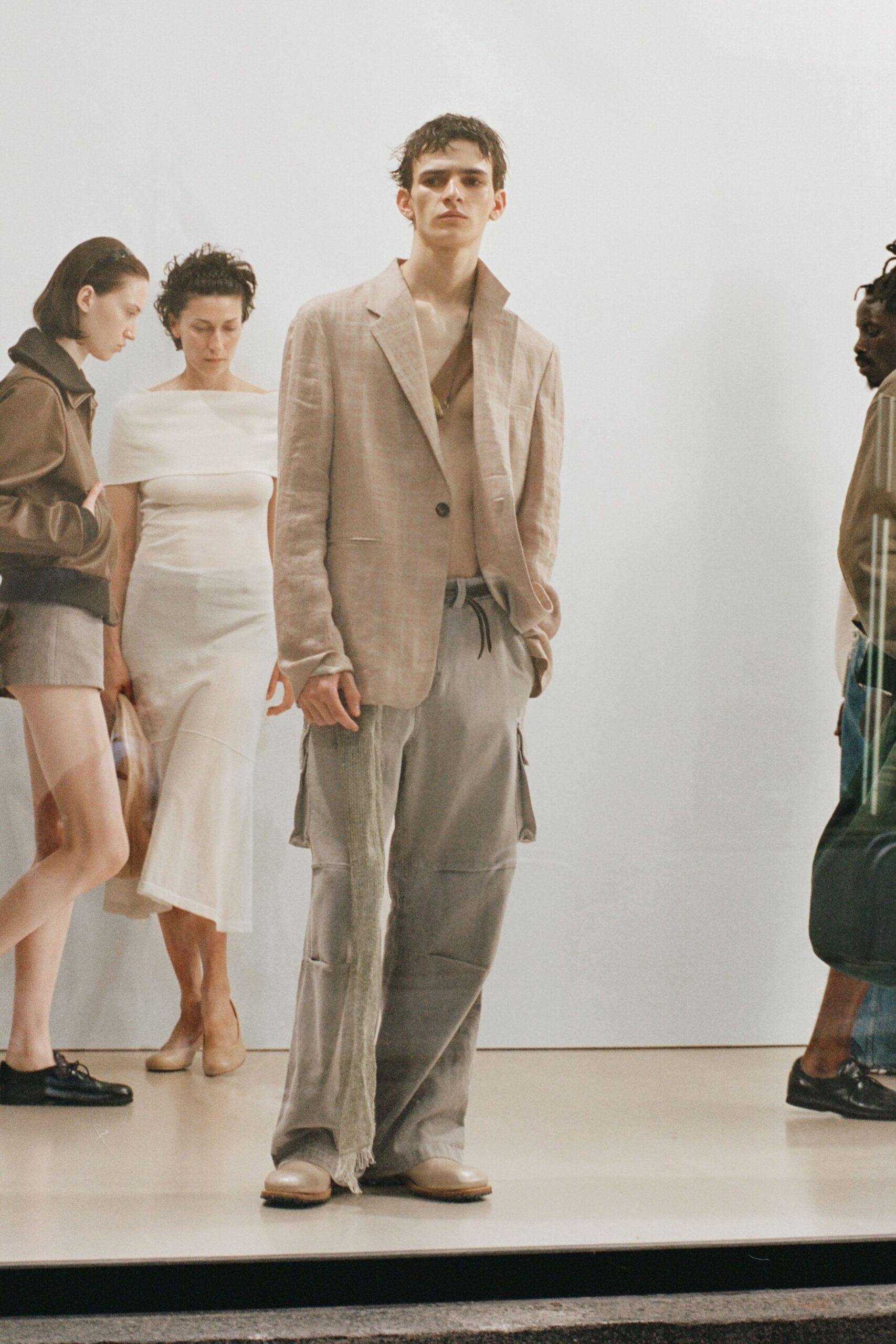 beige tailored blazer and gray cargo pants