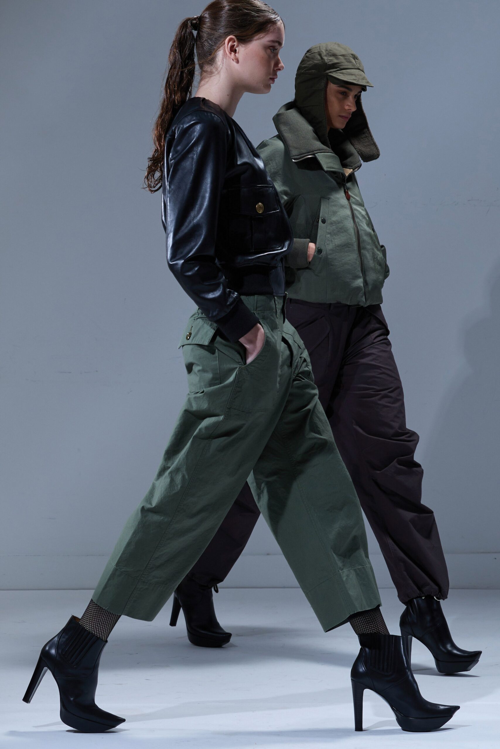 black leather jacket and green cargo pants