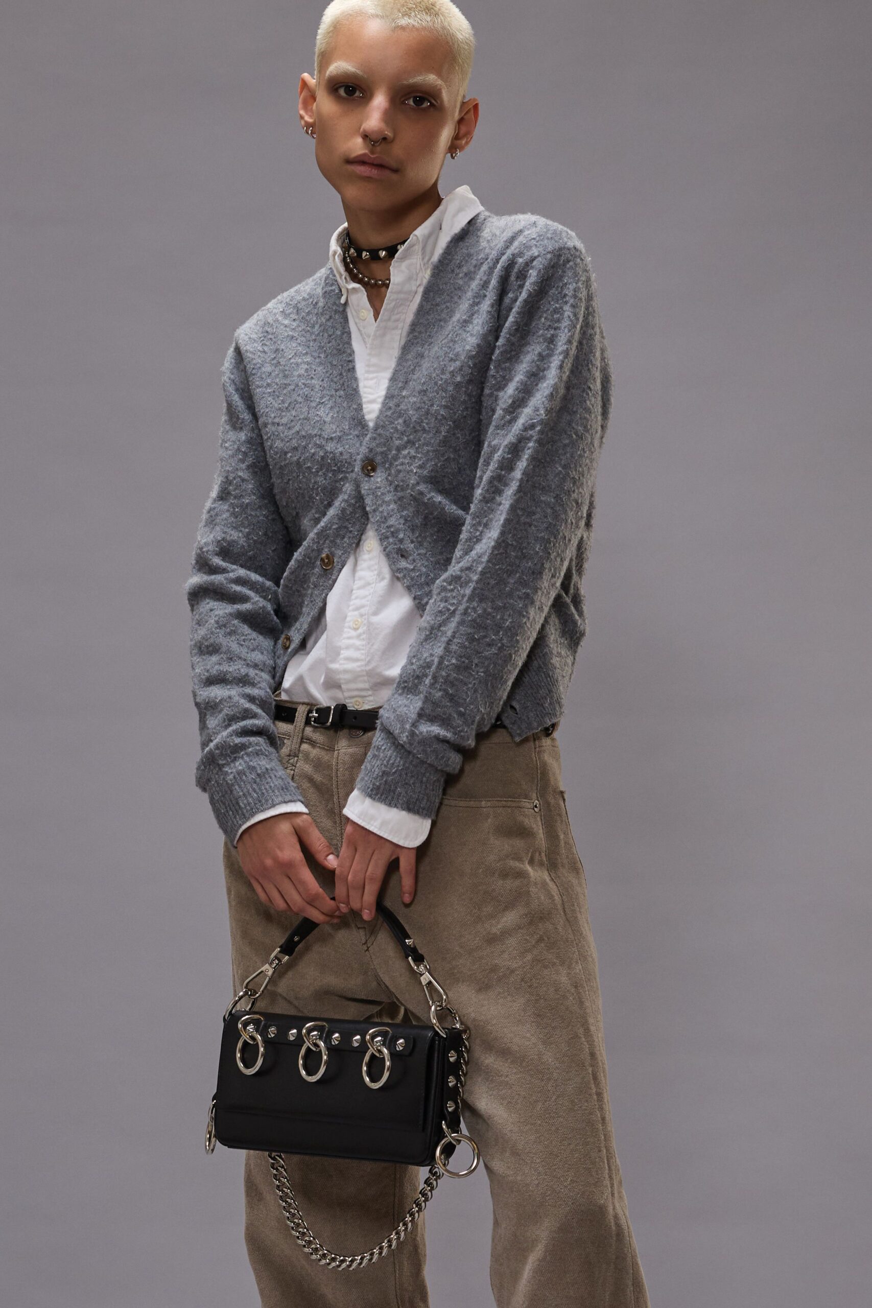 gray cardigan white shirt beige pants
