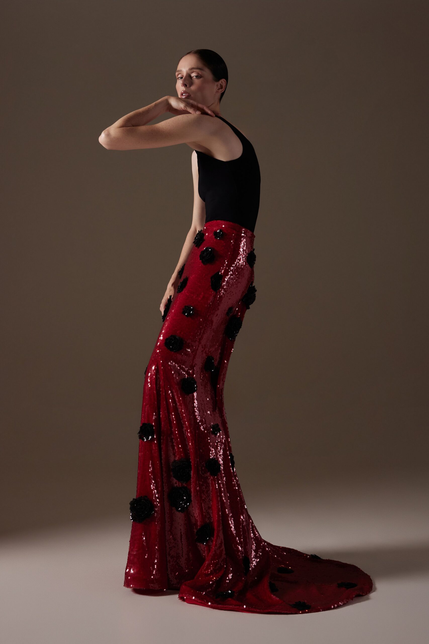 red sequin gown with black embellishments