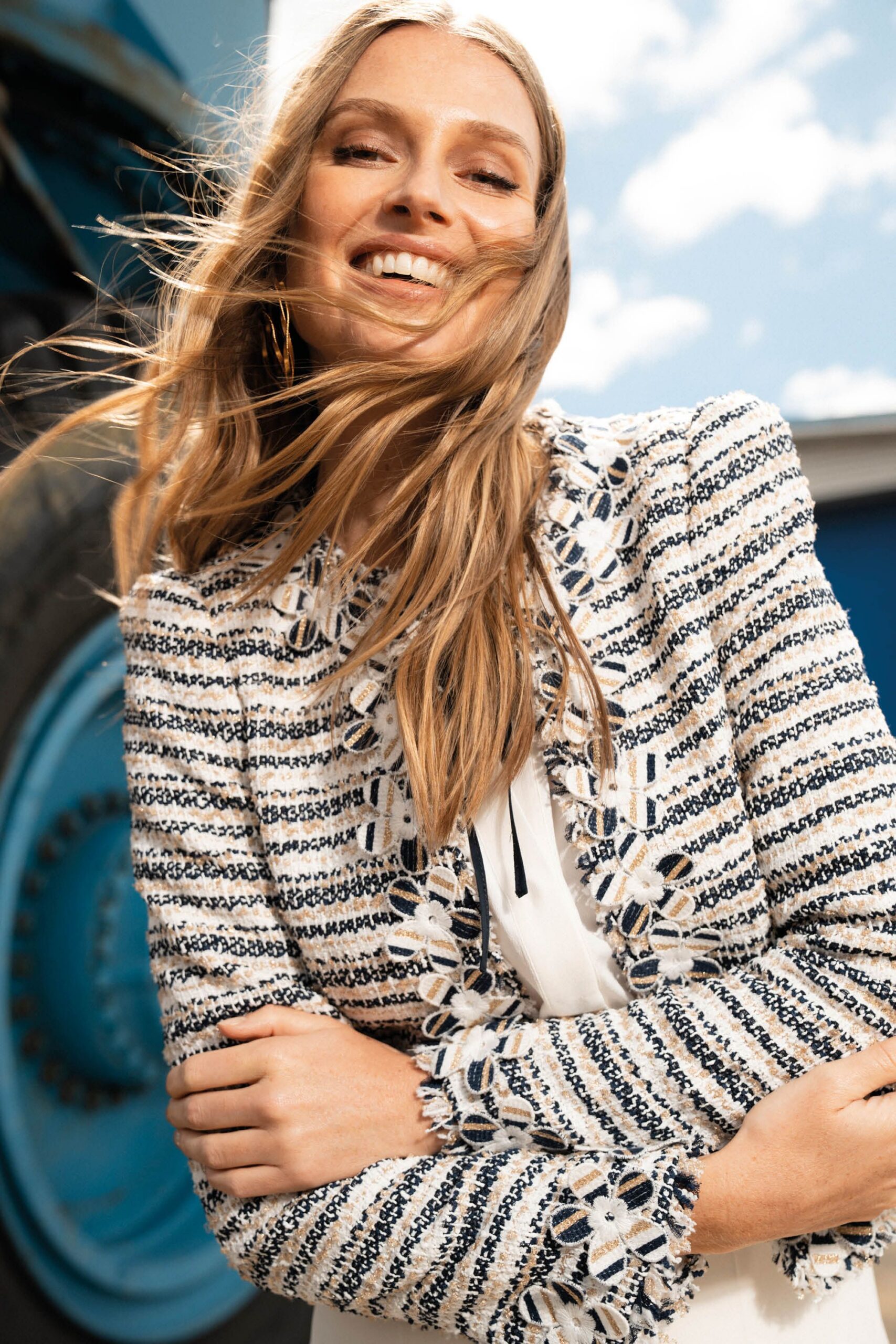 blue and white embroidered jacket with white top